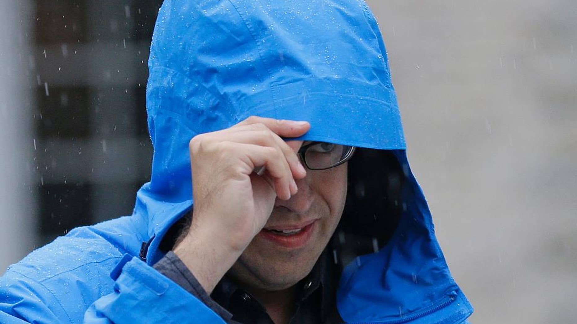 FILE - In this July 7, 2015, file photo, Subway restaurant spokesman Jared Fogle walks to a waiting car as he leaves his home in Zionsville, Ind. Fox 59 television station reported Tuesday, Aug. 18 that the Subway pitchman is expected to plead guilty to child-pornography charges, citing sources it did not identify. (AP Photo/Michael Conroy, File)