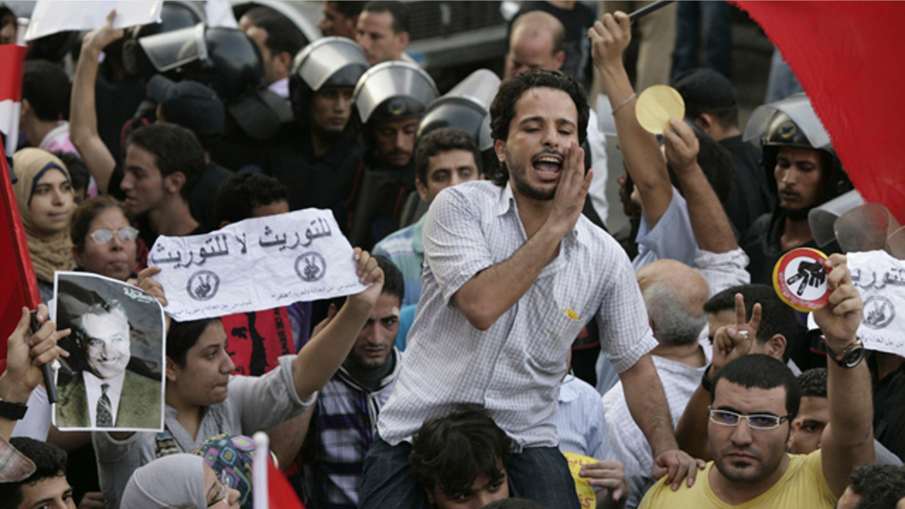 September 21: Egyptian activists shout anti - succession slogans during a protest in Cairo, Egypt. (AP)