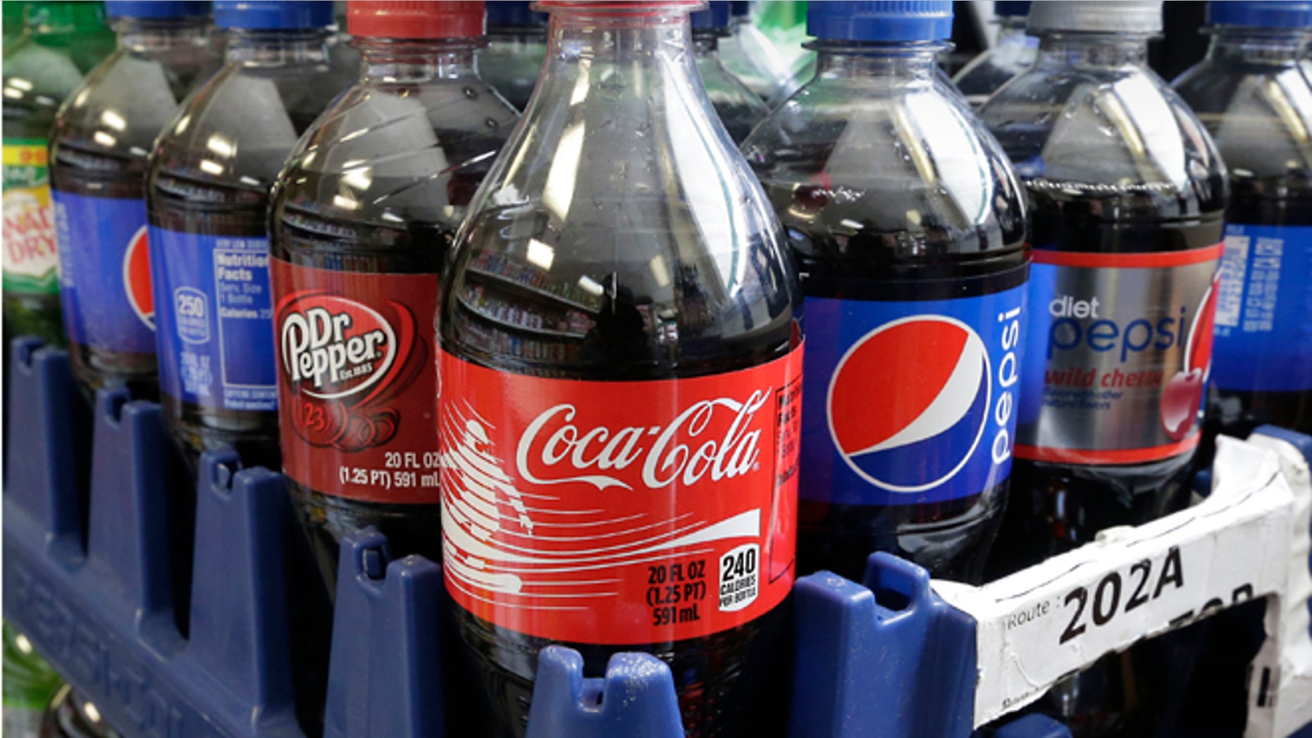 California would become the first state to require warning labels on the front of sodas and other sugary drinks under proposed legislation announced in Sacramento, Calif., Thursday, Feb. 13, 2014. A bill SB1000, by Sen. William Monning D-Carmel, would require manufacturers to place warnings on beverage containers that have added sweeteners that have 75 or more calories in every 12 ounces. The beverage industry notes that drink containers list the number of calories on the label. (AP Photo/Rich Pedroncelli)