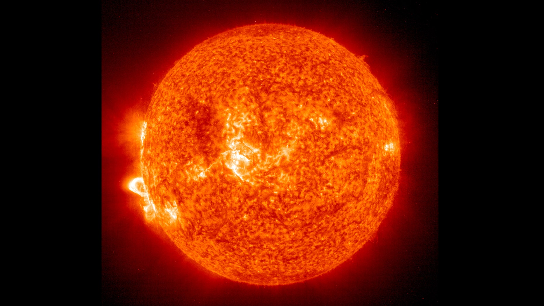 IN SPACE - NOVEMBER 18: In this handout photo provided by NASA, a Solar and Heliospheric Observatory image shows Region 486 that unleashed a record flare last week (lower left) November 18, 2003 on the sun. The spot itself cannot yet be seen but large, hot, gas-filled loops above this region are visible. These post-flare loops are still active. (Photo by NASA via Getty Images)