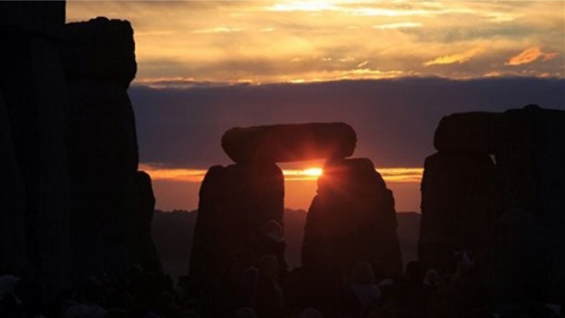 June 21, 2010: The sun rises behind the Stonehenge monument in England during the summer solstice, shortly after 4:52 am, early Monday.