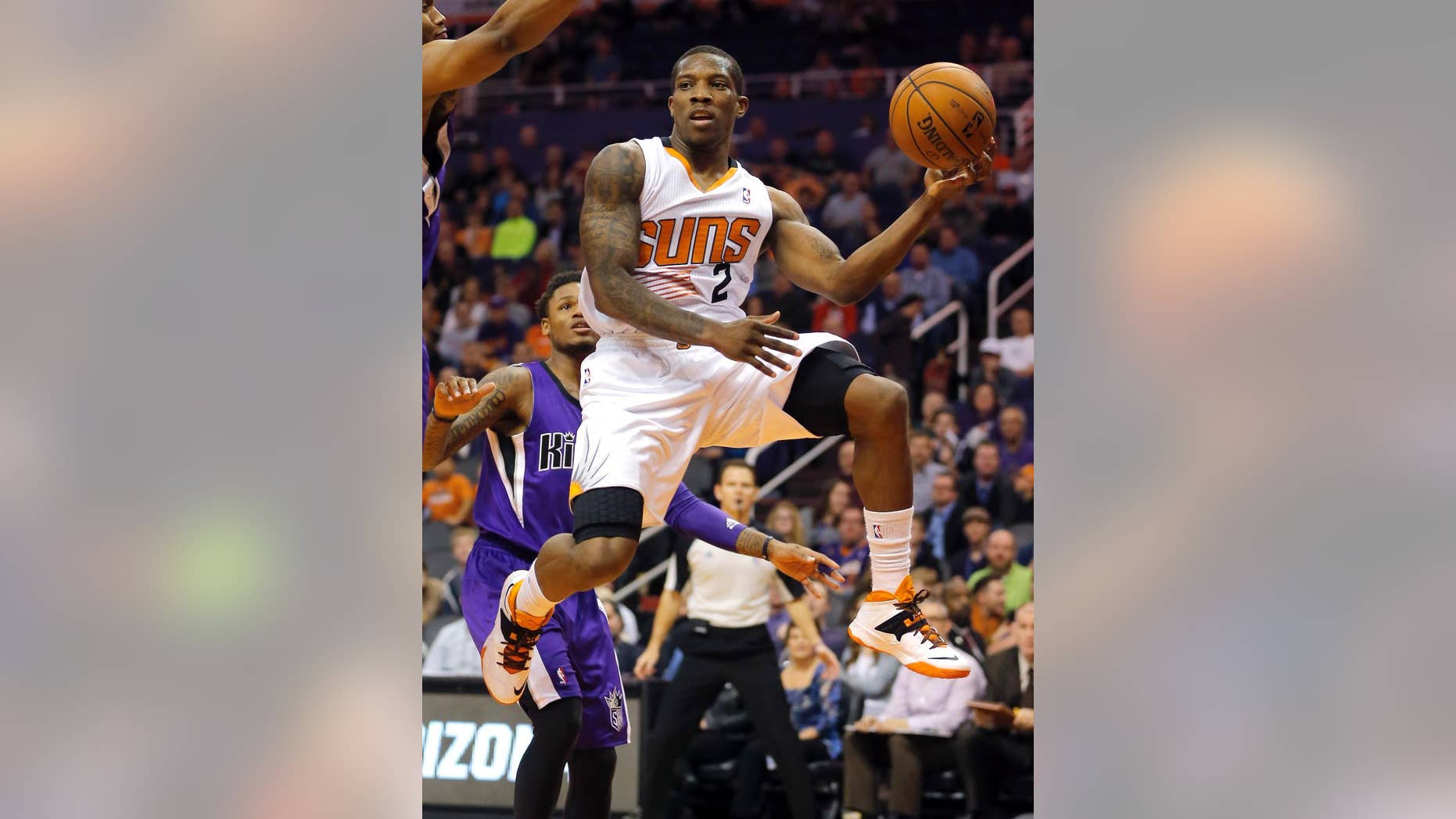 FILE - In this Dec. 13, 2013, file photo, Phoenix Suns' Eric Bledsoe (2) passes against the Sacramento Kings during an NBA basketball game in Phoenix. A person with knowledge of the deal says the Suns and Bledsoe have reached agreement on a five-year, $70 million contract. The person spoke Wednesday, Sept. 24, 2014, on condition of anonymity because the agreement has not been officially announced. (AP Photo/Matt York, File)
