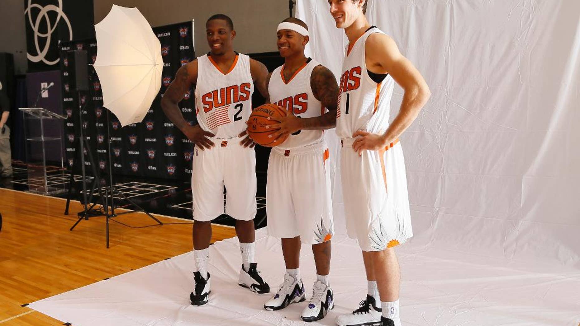Phoenix Suns' Goran Dragic (1), of Slovenia, Isaiah Thomas, center, and Eric Bledsoe pose for a photo during NBA basketball media day, Monday, Sept. 29, 2014, in Phoenix. (AP Photo/Matt York)
