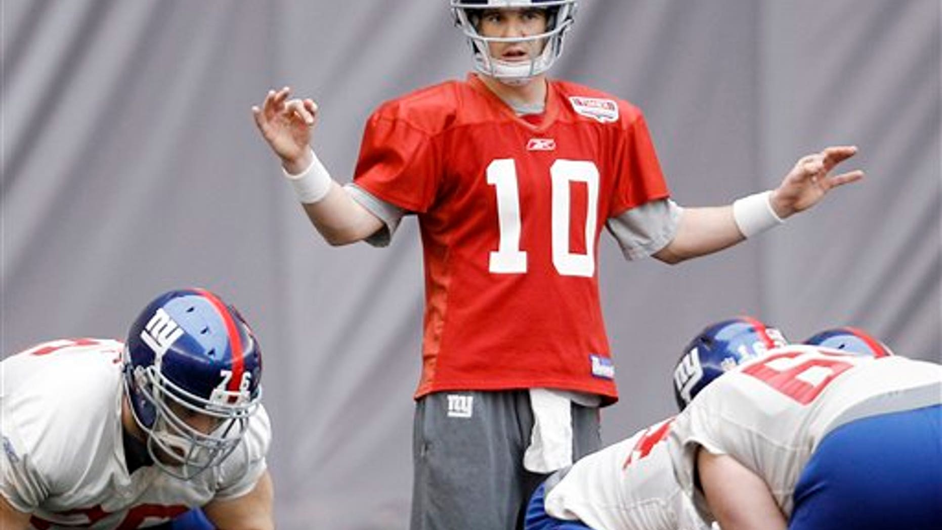 Feb. 3: New York Giants' Eli Manning (10) gives direction during practice in Indianapolis.