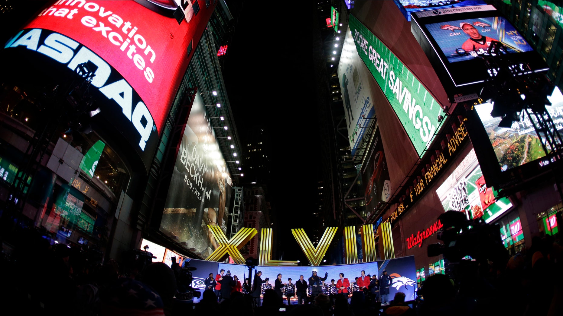 The Roman numerals for Super Bowl XLVIII are unveiled on Super Bowl Boulevard in Times Square Wednesday, Jan. 29, 2014, in New York. The Seattle Seahawks are scheduled to play the Denver Broncos in the NFL Super Bowl XLVIII football game on Sunday, Feb. 2, in East Rutherford, N.J. (AP Photo/Charlie Riedel)