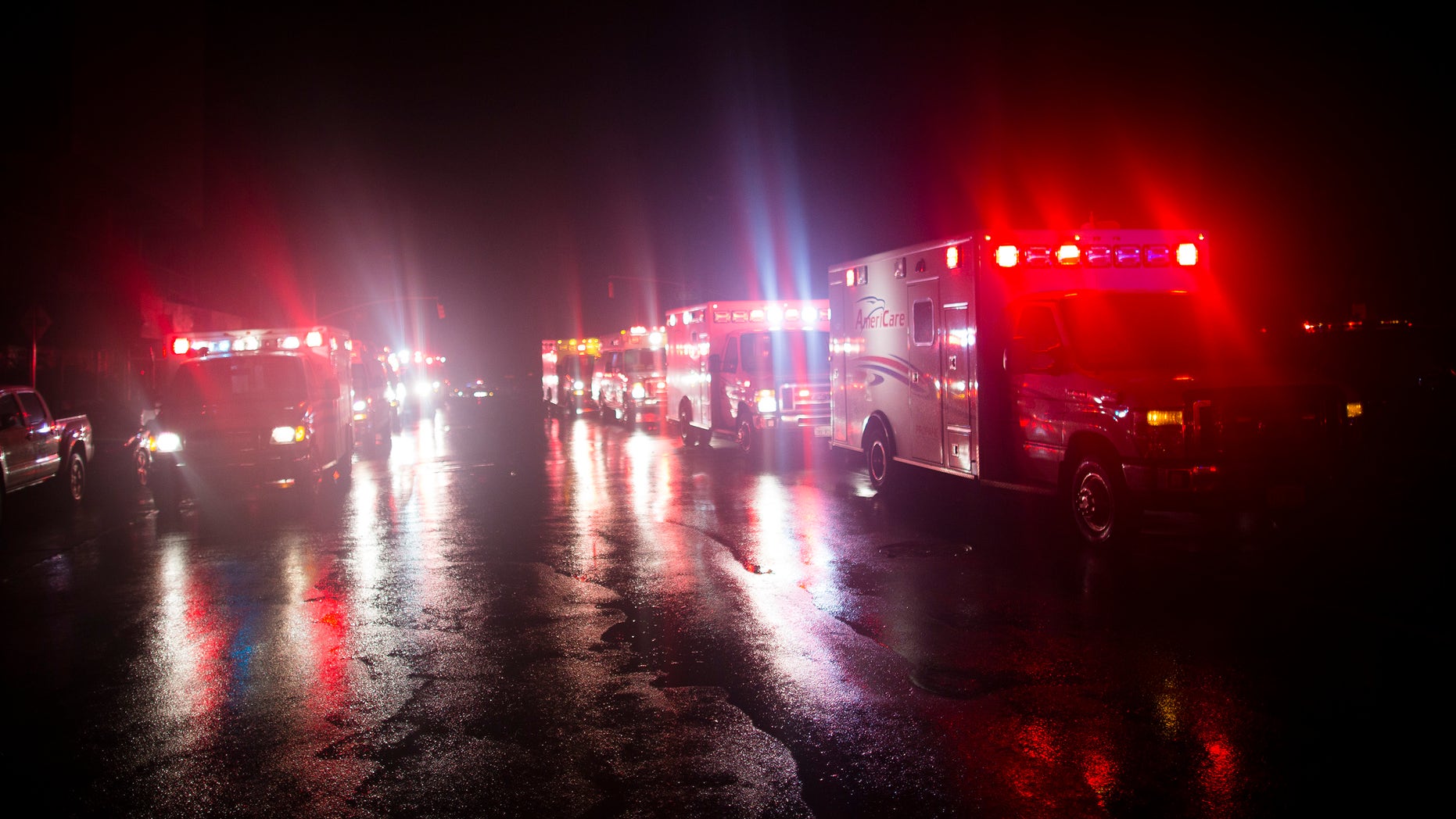 Ambulances wait outside New York University Tisch Hospital during an evacuation of the hospital after its backup generator failed when the power was knocked out by a superstorm, Monday, Oct. 29, 2012, in New York. Dozens of ambulances lined up outside NYU Tisch Hospital on Monday night as doctors and nurses began the slow process of taking people out. (AP Photo/John Minchillo)