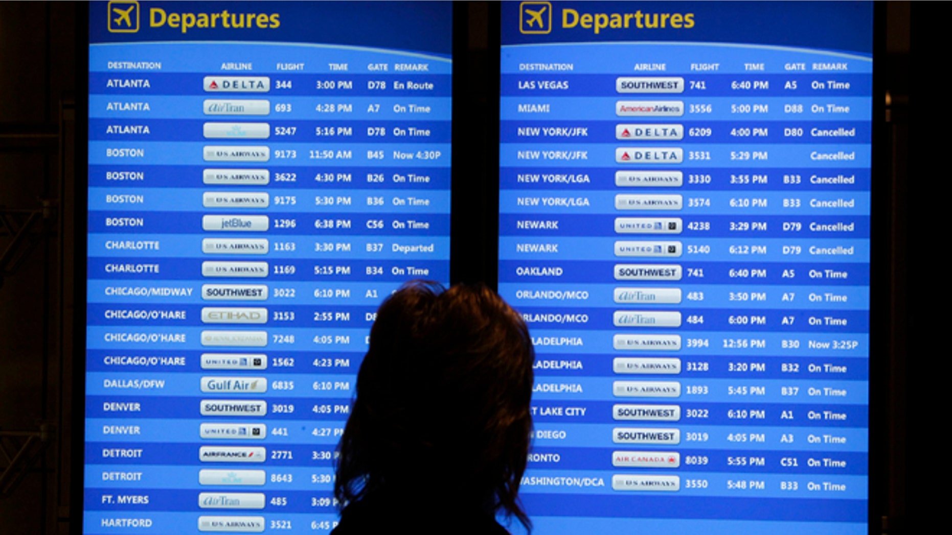 Oct. 31, 2012: A passenger checks the departures board at Pittsburgh International Airport.