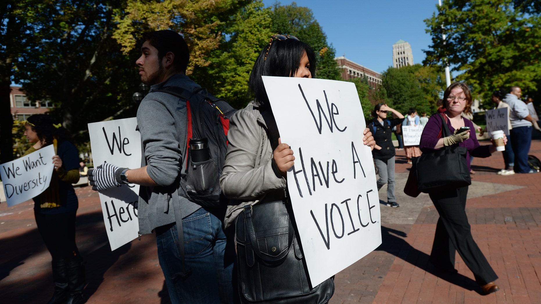 Oct. 9, 2013 - University of Michigan students hold signs as they participate in a "Freeze Out" rally to promote diversity at the Diag on the University of Michigan campus in Ann Arbor, Mich. After the Supreme Court ruled 10 years ago that race could be a factor in college admissions in a case from Michigan, opponents of affirmative action persuaded the state's voters to outlaw any consideration of race. Now, the high court is weighing whether the voter-approved change to Michigan's constitution in 2006 is itself discriminatory.