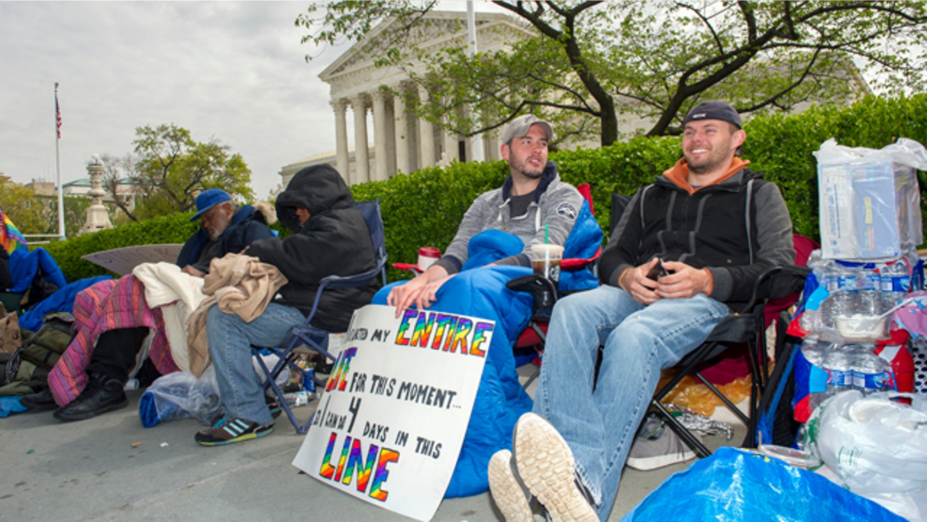 April 27, 2015: Sean Varsho, 28, of Chicago, left, and Brandon Dawson, 26, of Warrenton Va., have been waiting in line for the past three days for a seat for Tuesday's Supreme Court hearing on gay marriage. The opponents of same-sex marriage are urging the court to resist embracing what they see as a radical change in society's view of what constitutes marriage. (AP Photo/Cliff Owen)