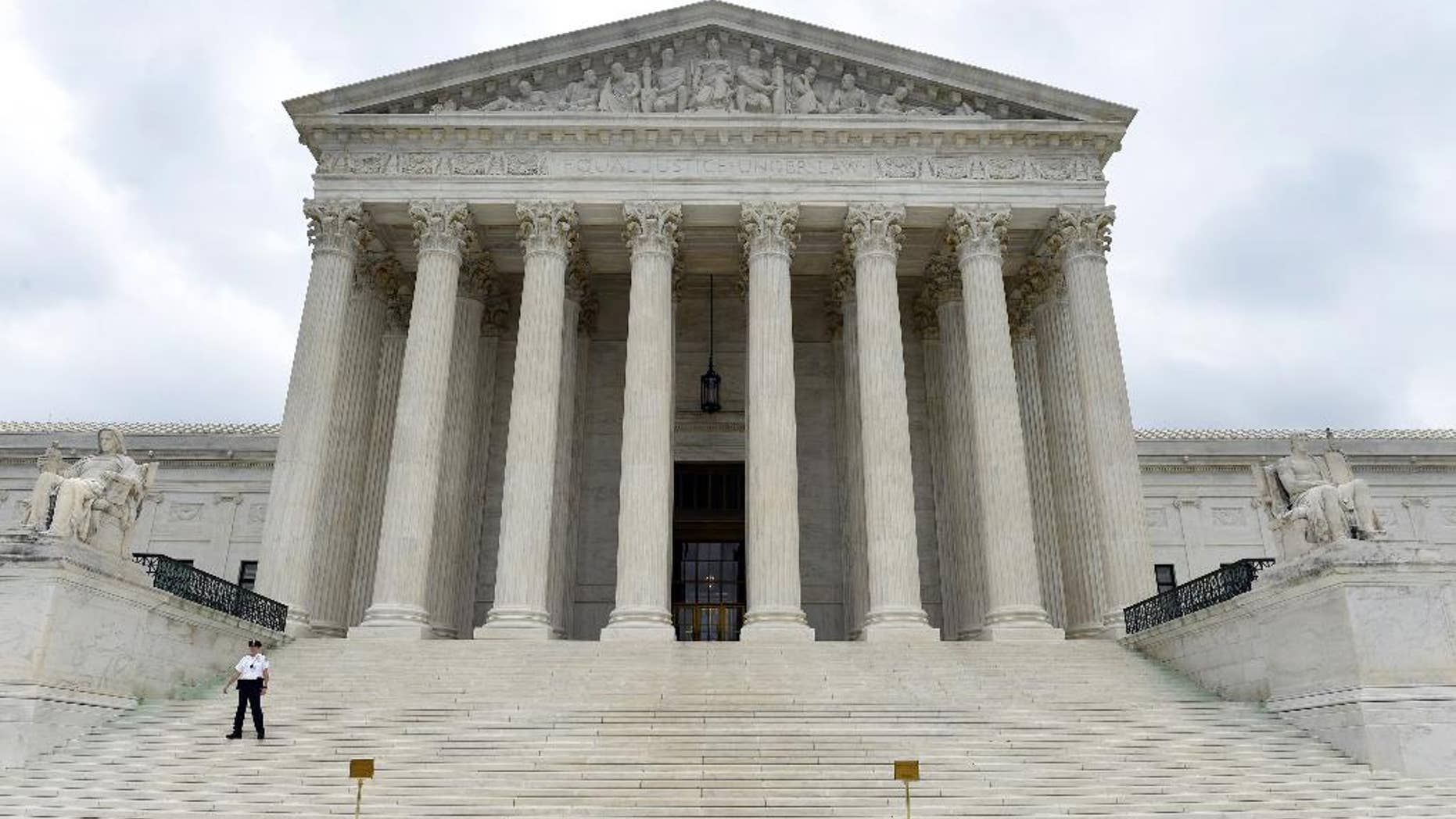 This photo taken Friday, Oct. 3, 2014, shows the U.S. Supreme Court in Washington. A Supreme Court term that is starting Monday, Oct. 6, 2014, with a lack of headline-grabbing cases may end with a blockbuster that helps define the legacy of the court under Chief Justice John Roberts. That's because the justices appear likely to take on the issue of same-sex marriage and decide once and for all whether gay and lesbian couples have a constitutional right to marry. (AP Photo/Susan Walsh)