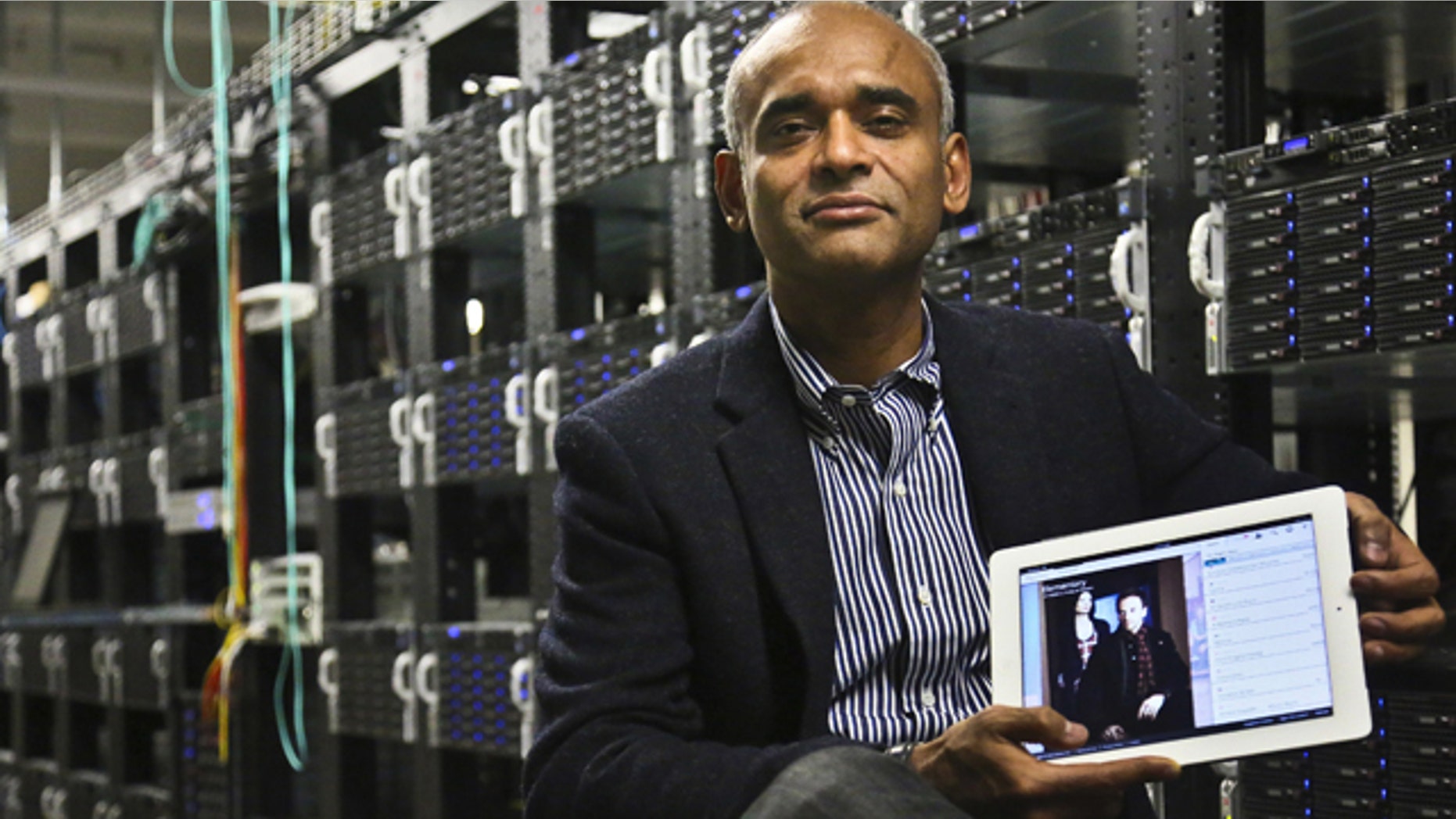 FILE - This Dec. 20, 2012 file photo shows Chet Kanojia, founder and CEO of Aereo, Inc., holding a tablet displaying his company's technology, in New York. The Supreme Court has ruled that a start-up Internet company has to pay broadcasters when it takes television programs from the airwaves and allows subscribers to watch them on smartphones and other portable devices. The justices said Wednesday by a 6-3 vote that Aereo Inc. is violating the broadcasters' copyrights by taking the signals for free. The ruling preserves the ability of the television networks to collect huge fees from cable and satellite systems that transmit their programming. (AP Photo/Bebeto Matthews, File)