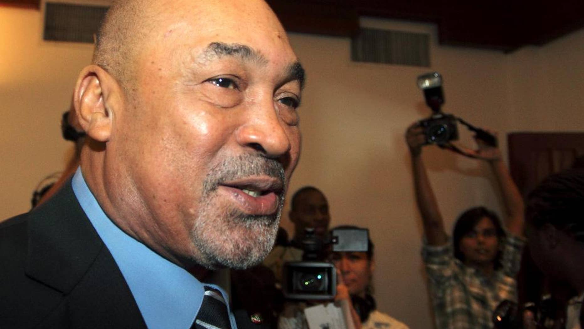 FILE - In this Sept. 2, 2010 file photo, Suriname's President Desi Bouterse speaks with journalists at the presidential cabinet office in Paramaribo, Suriname. Bouterse is betting that the Monday, May 25, 2015 election to choose the South American country’s next Parliament will keep him and his party in power for another five years. (AP Photo/Edward Troon, File)