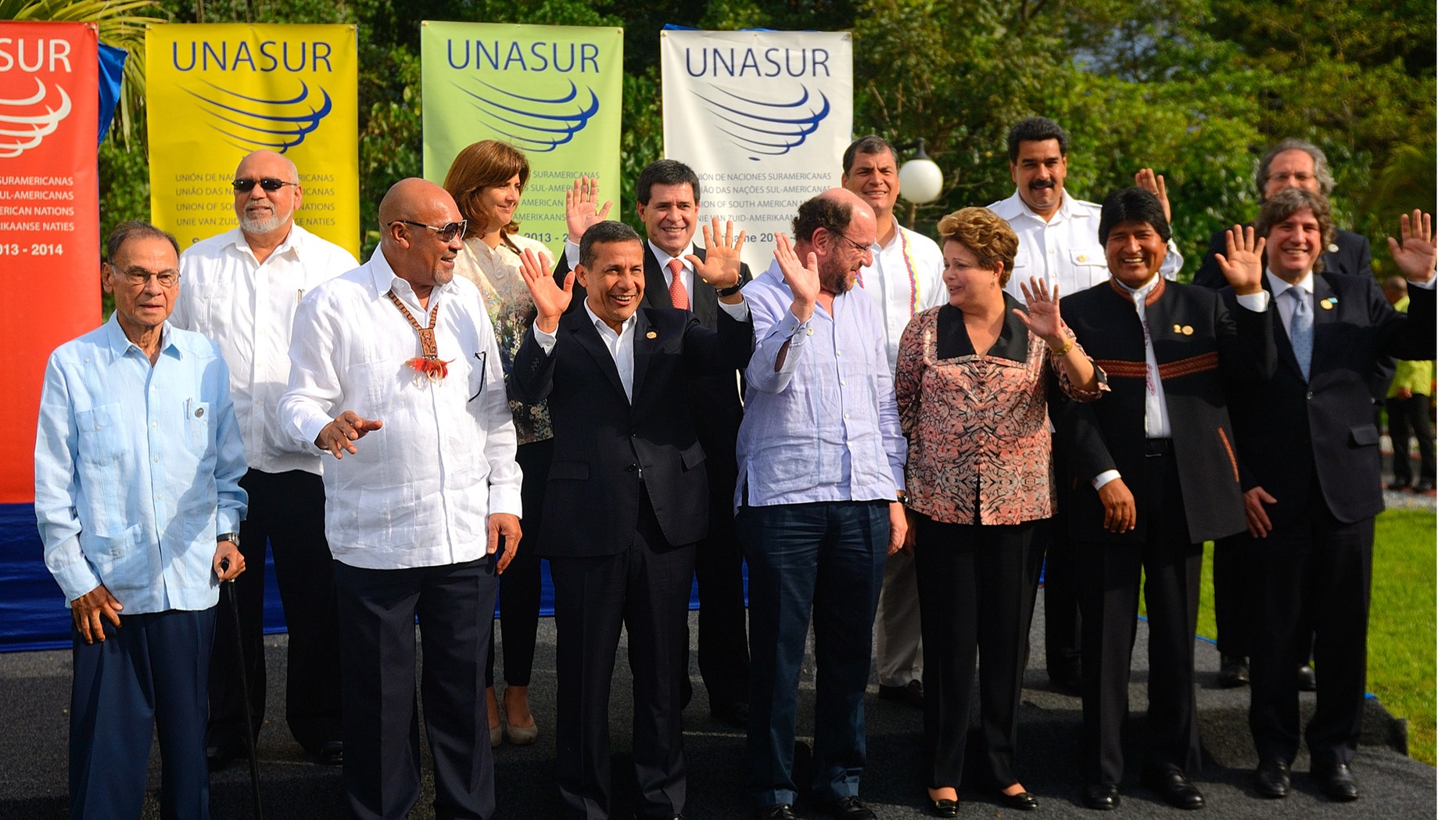 Heads of state and representatives of South American nations pose for the group photo at the VII Summit of the Union of South American Nations (UNASUR) in Paramaribo, Suriname, Friday, Aug. 30, 2013. Front row from left, UNASUR Secretary General Ali Rodriguez, Suriname's President Desi Bouterse, Peru's President Ollanta Humala, Chile's Foreign Minister Alfredo Moreno, Brazil's President Dilma Rousseff, Bolivia's President Evo Morales and Argentina's Vice-President Amado Boudou. Back row from left, Guyana's President Donald Ramotar, Colombia's Foreign Minister Maria Angela Holguin, Paraguay's President Horacio Cartes, Ecuador's President Rafael Correa, Venezuela's President Nicolas Maduro and Uruguay's Foreign Minister Luis Almagro. (AP Photo/Ertugrul Kilic)