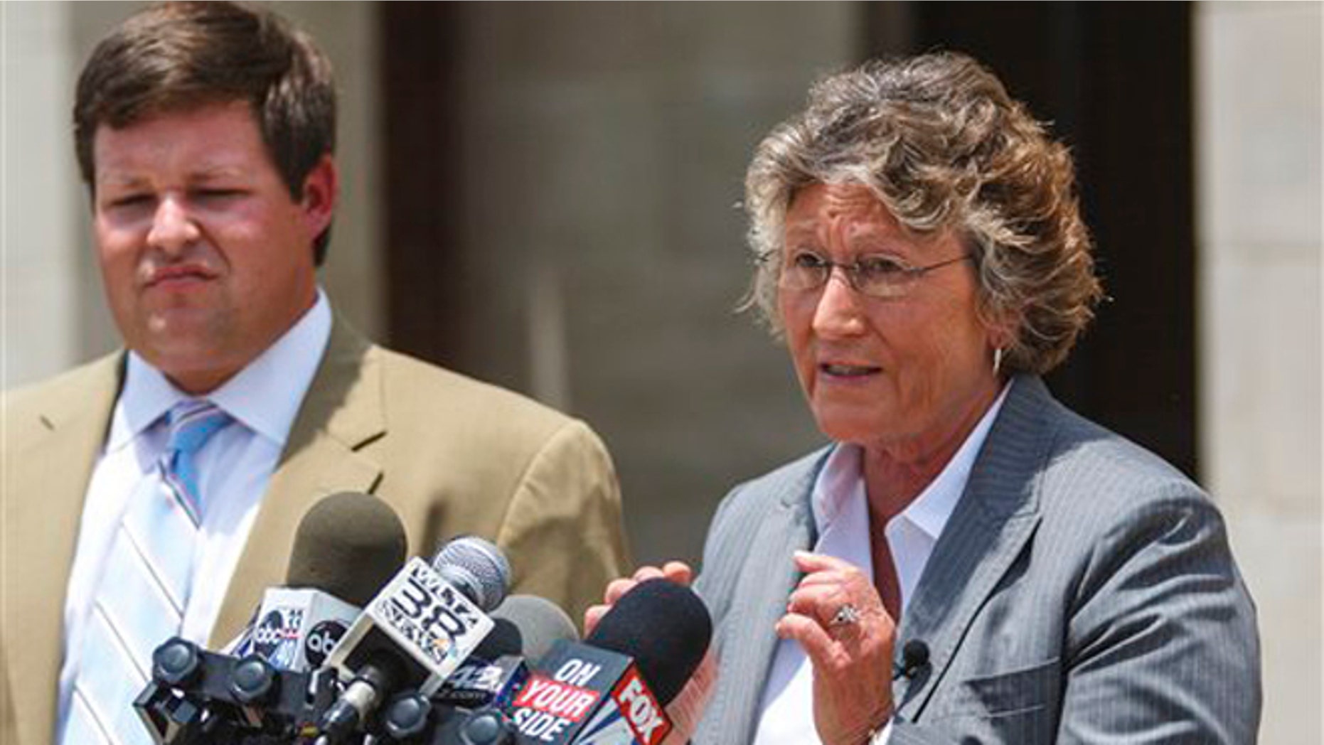 June 14, 2012: Susan James, of Susan James & Associates of Montgomery, right, with fellow attny. Garrett Saucer, left, gives a press conference at the Russell County Judicial Center in Phenix City, Ala., to discuss representing Desmonte Leonard