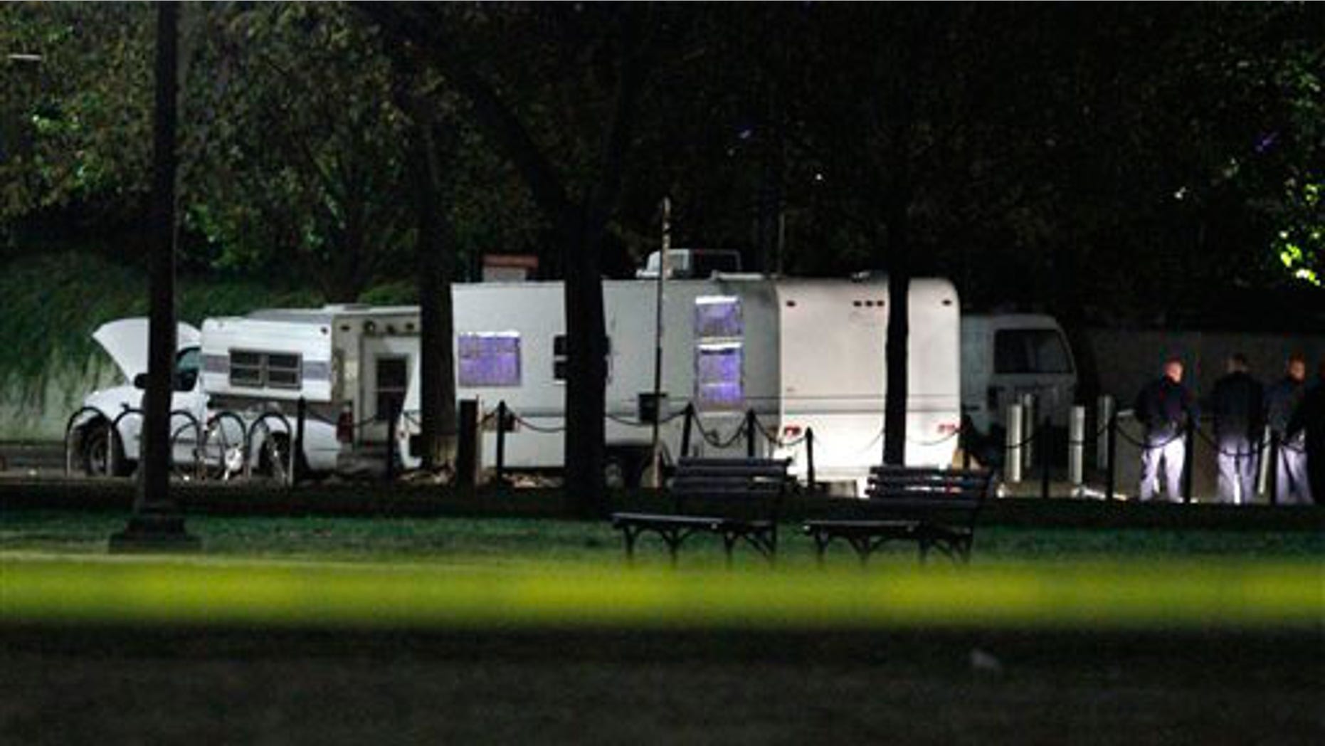 U.S. Park Police investigate a suspicious vehicle parked by the National Mall near the U.S. Capitol in Washington, on Wednesday, Nov. 3, 2010. U.S. Park Police say a man has been arrested after guns and ammunition were found inside a vehicle parked near the National Mall.