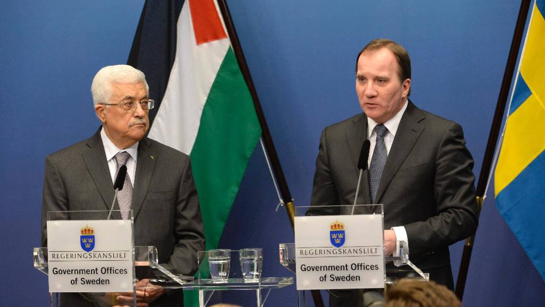 Palestinian President Mahmoud Abbas, left, and Sweden's Prime Minister Stefan Lofven during a press conference at the government headquarters Rosenbad in Stockholm, Sweden Tuesday, Feb. 10, 2015. President Abbas is on a one day official visit to Sweden. (AP Photo/TT/ Jonas Ekstromer ) SWEDEN OUT
