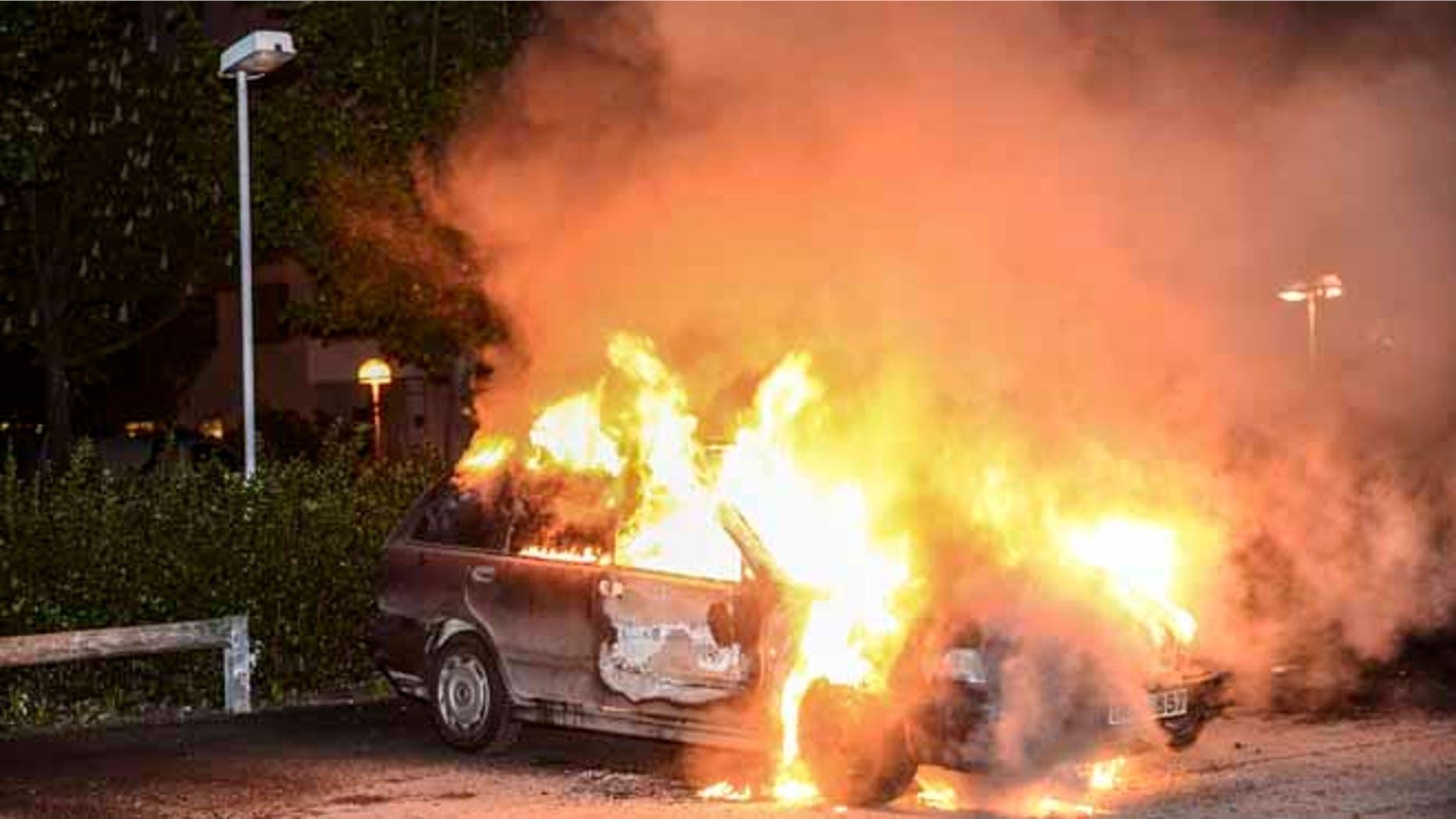 May 21, 2013: A burnt out car, in the Stockholm suburb of Kista after youths rioted in several different suburbs around Stockholm for a third executive night. Immigrant youth in sleepy suburban communities run amok, hurling rocks at police and torching cars, restaurants and culture centers.