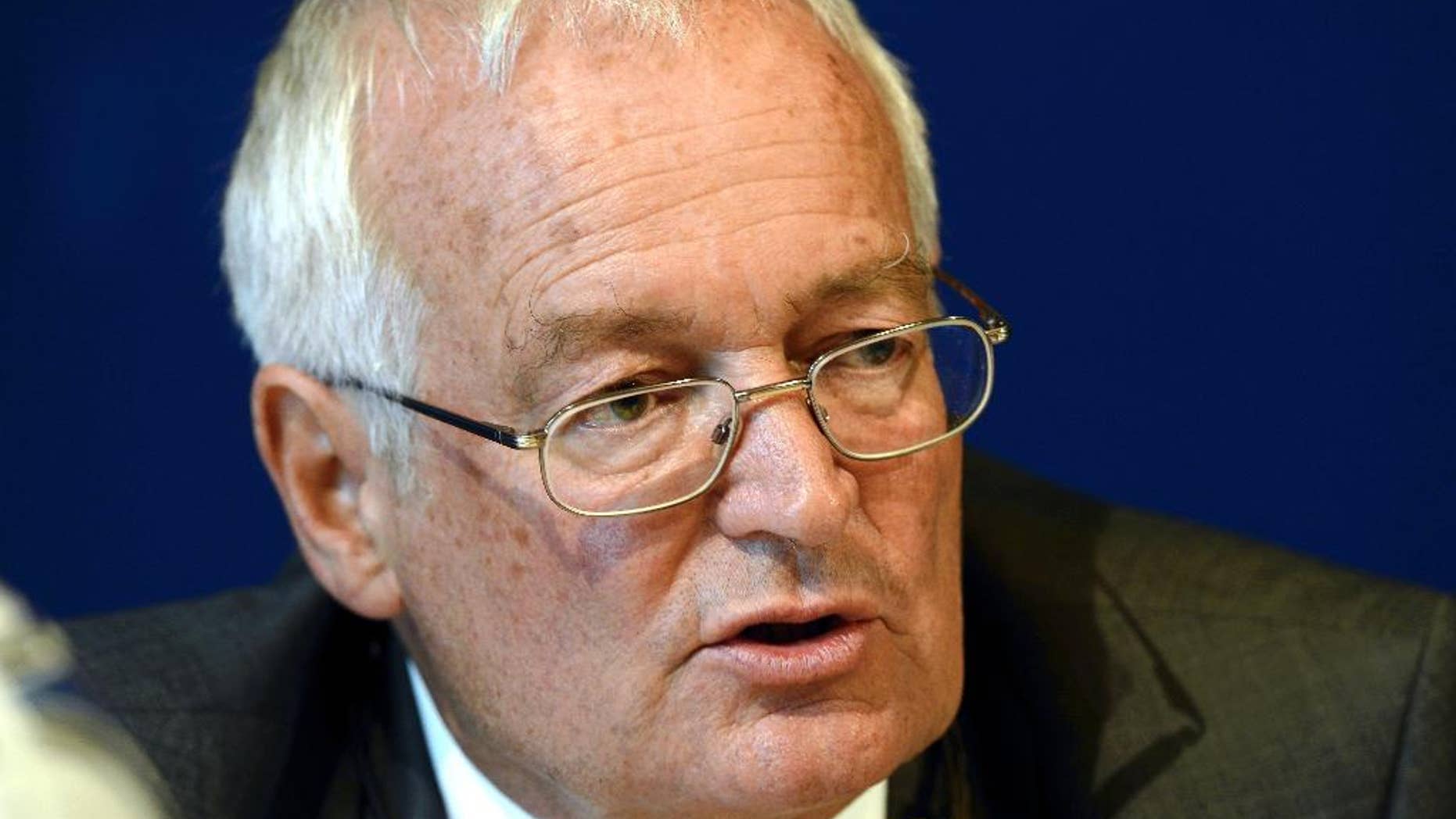 FILE - In this July 27, 2012 file picture chairman of the two chambers of the new FIFA Ethics Committee Hans Joachim Eckert from Germany speaks during a press conference at the Home of FIFA in Zurich, Switzerland. FIFA ethics judge Hans Joachim Eckert says Friday Nov. 14, 2014, he wants to talk to American investigator Michael Garcia, who rejected his World Cup bid corruption report as "incomplete and erroneous." Eckert tells The Associated Press " I must and want to first speak with Garcia." The German declined to discuss the conflict between the two men over the probe into the winning World Cup bids from Russia and Qatar. Eckert, whose report was based on Garcia's confidential investigation, cleared both countries of corruption and said there was no reason to re-open the votes for the 2018 and 2022 tournaments. (AP Photo/Keystone, Walter Bieri,File)