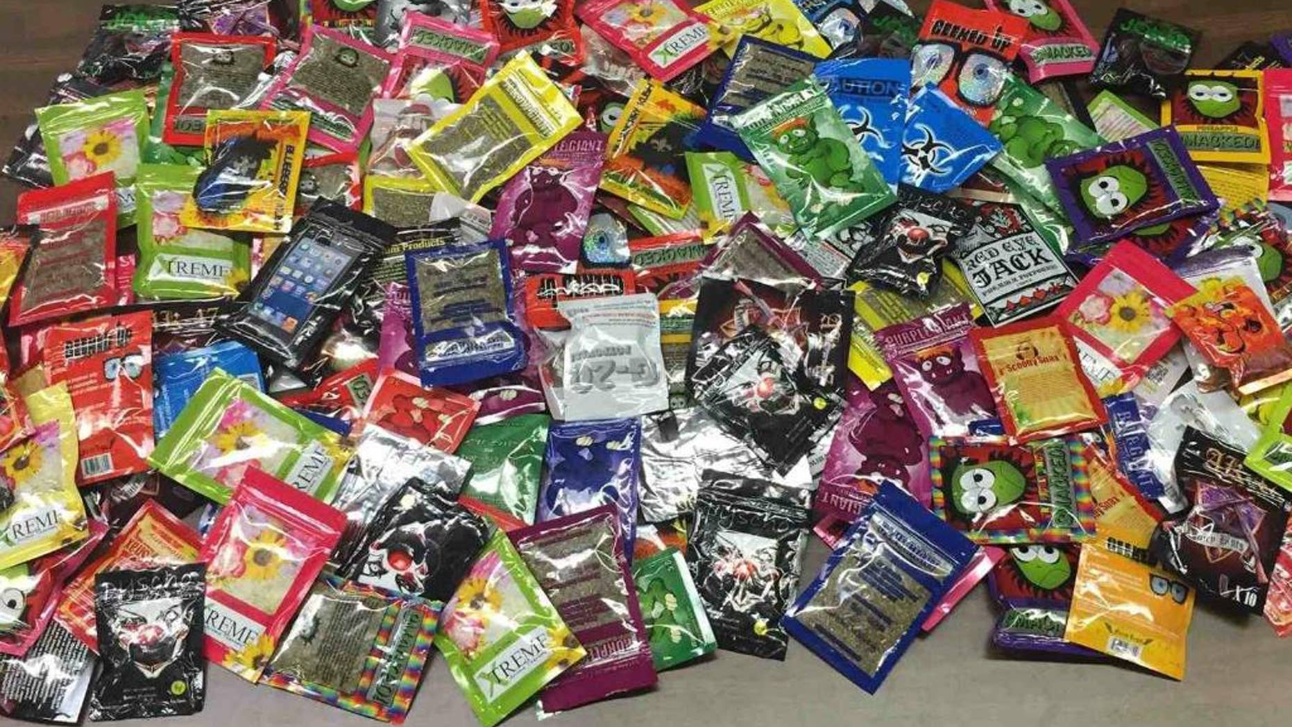 This photo provided Friday, Aug. 7, 2015 by New York Police Department shows packets of synthetic marijuana seized after a search warrant was served at a newsstand in Brooklyn, N.Y. (AP Photo/New York Police Department)