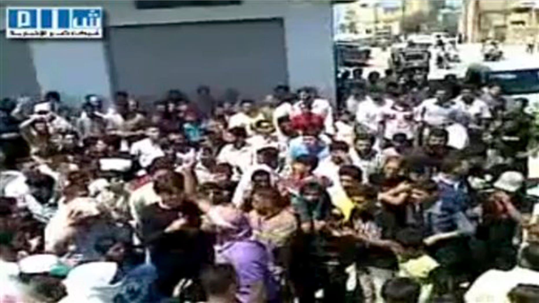Aug. 12, 2011: This image made from amateur video released by Shams News Network and accessed via The Associated Press Television News shows a protest march in Hama Syria.