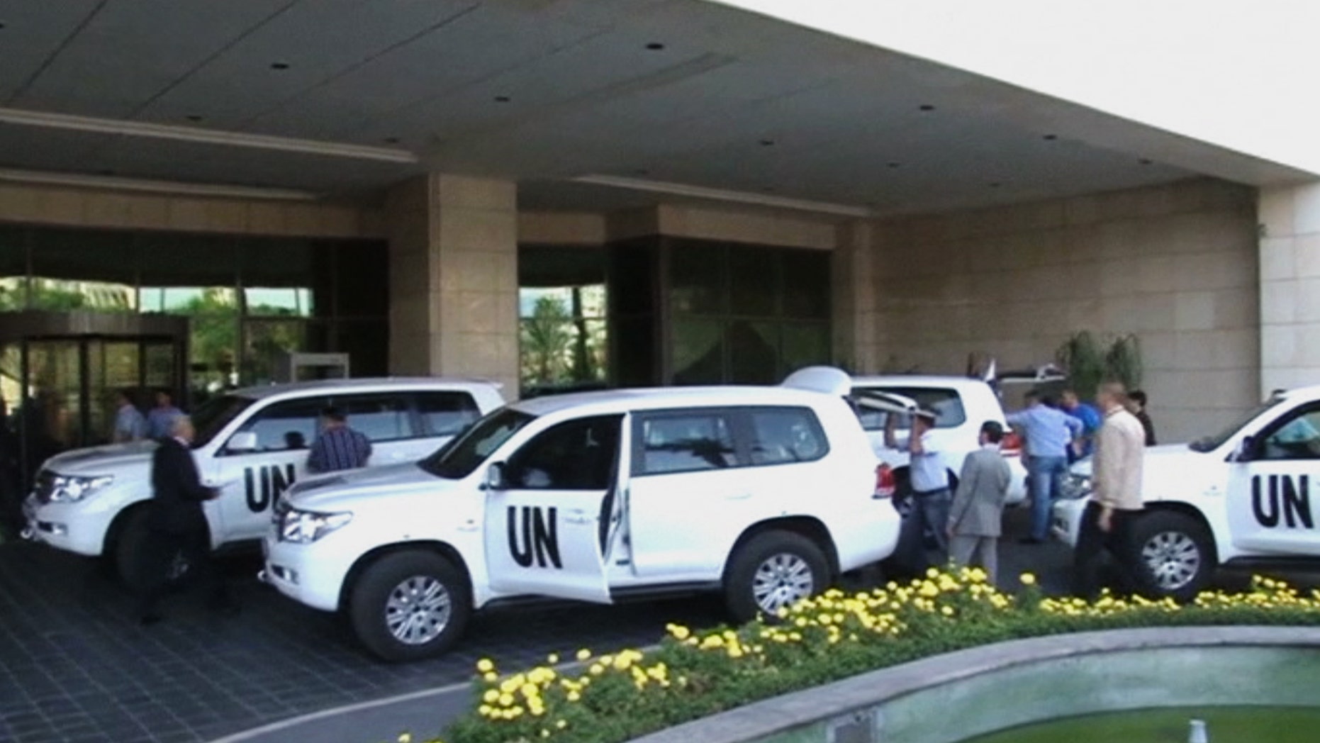 Aug. 18, 2013 - In this image made from video, U.N. weapon inspectors arrive at a hotel in Damascus, Syria for a long-delayed mission to investigate the alleged use of chemical arms in Syria's civil war.