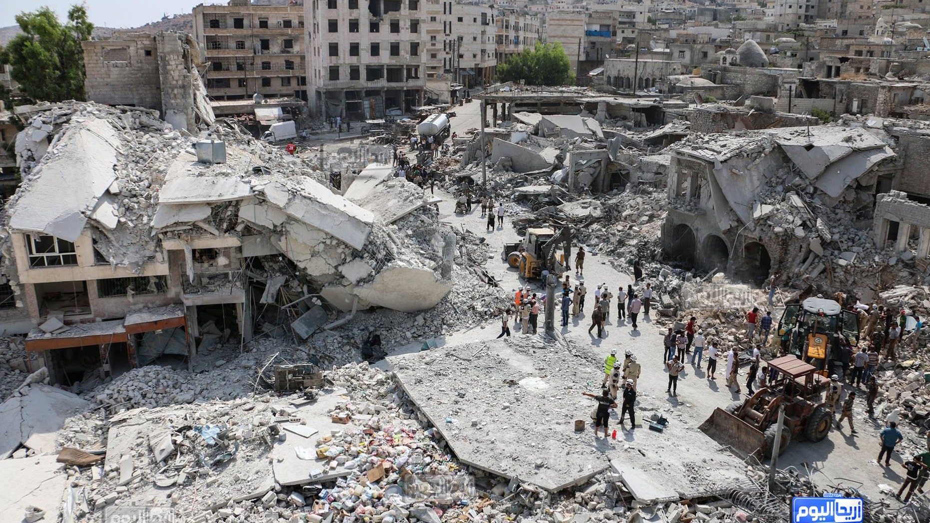Aug. 3, 2015 - The scene after a government warplane crashed in the center of the town of Ariha, in the northwestern province of Idlib, Syria. Air raids and the subsequent crash of a Syrian warplane in a residential area in the northwestern town of Ariha on Monday killed and wounded dozens of people, two activist groups said.