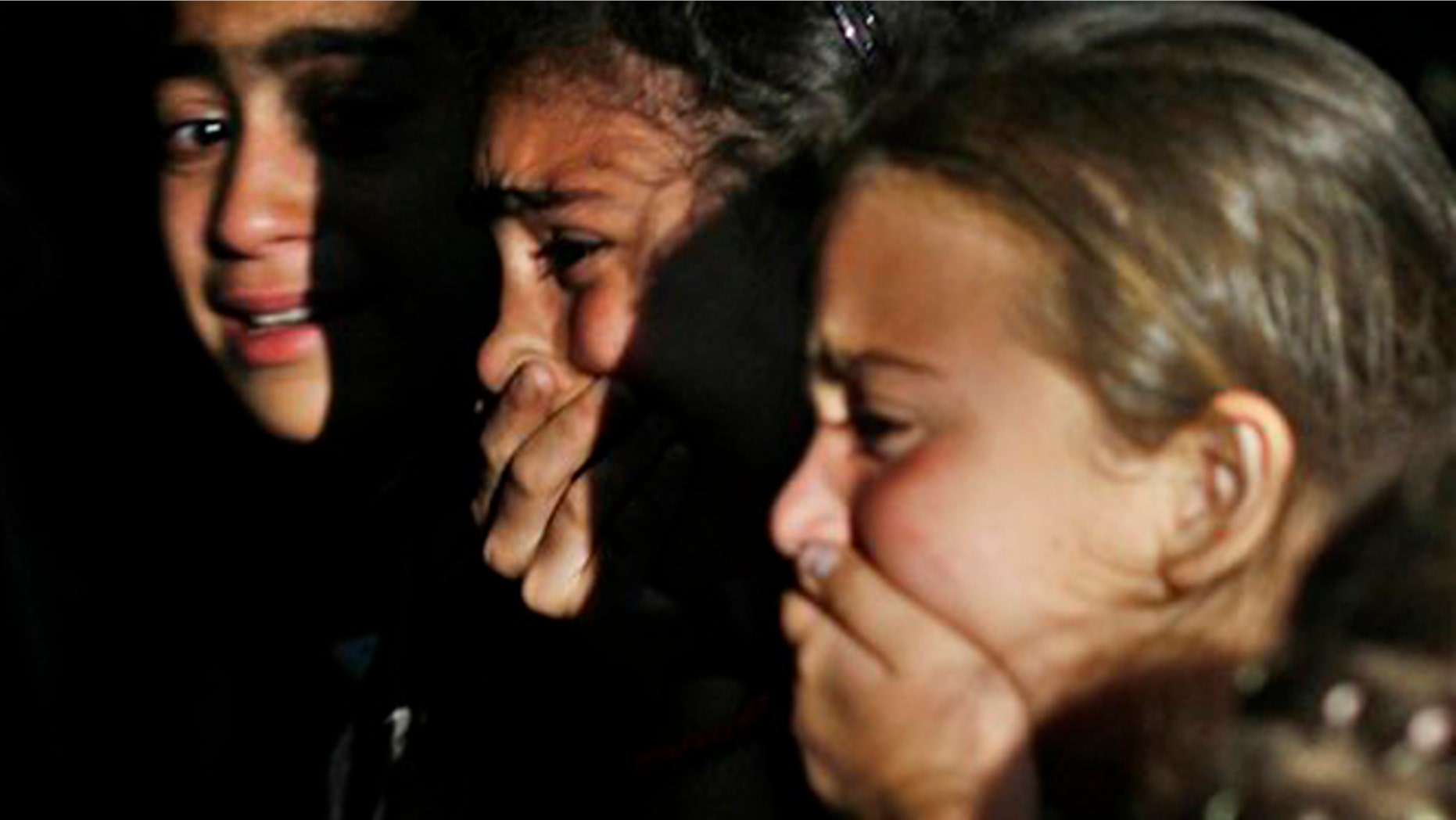 June 4, 2012: Relatives of a Free Syrian Army soldier killed during clashes with the regime gunmen mourn at his funeral.