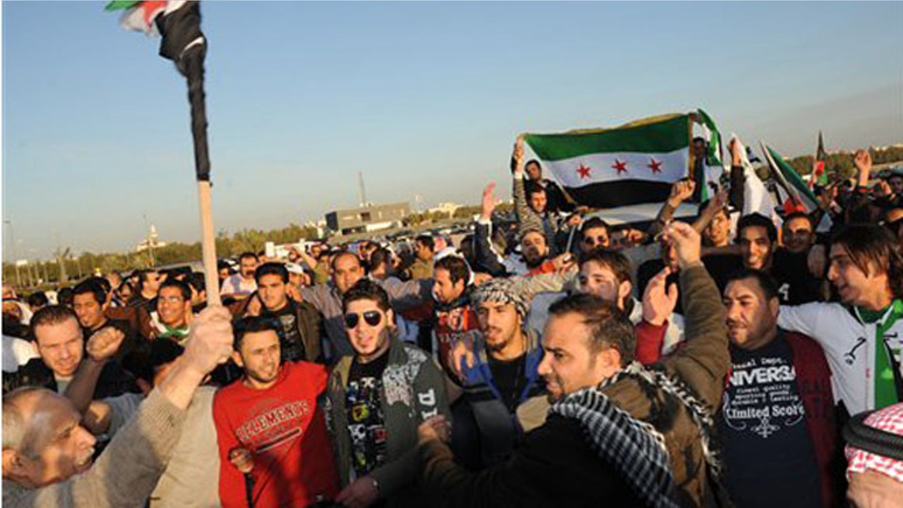 Feb. 4, 2012: Kuwaiti citizens and Syrians resident in Kuwait protest in front of the Syrian Embassy in Mishref, Kuwait City.
