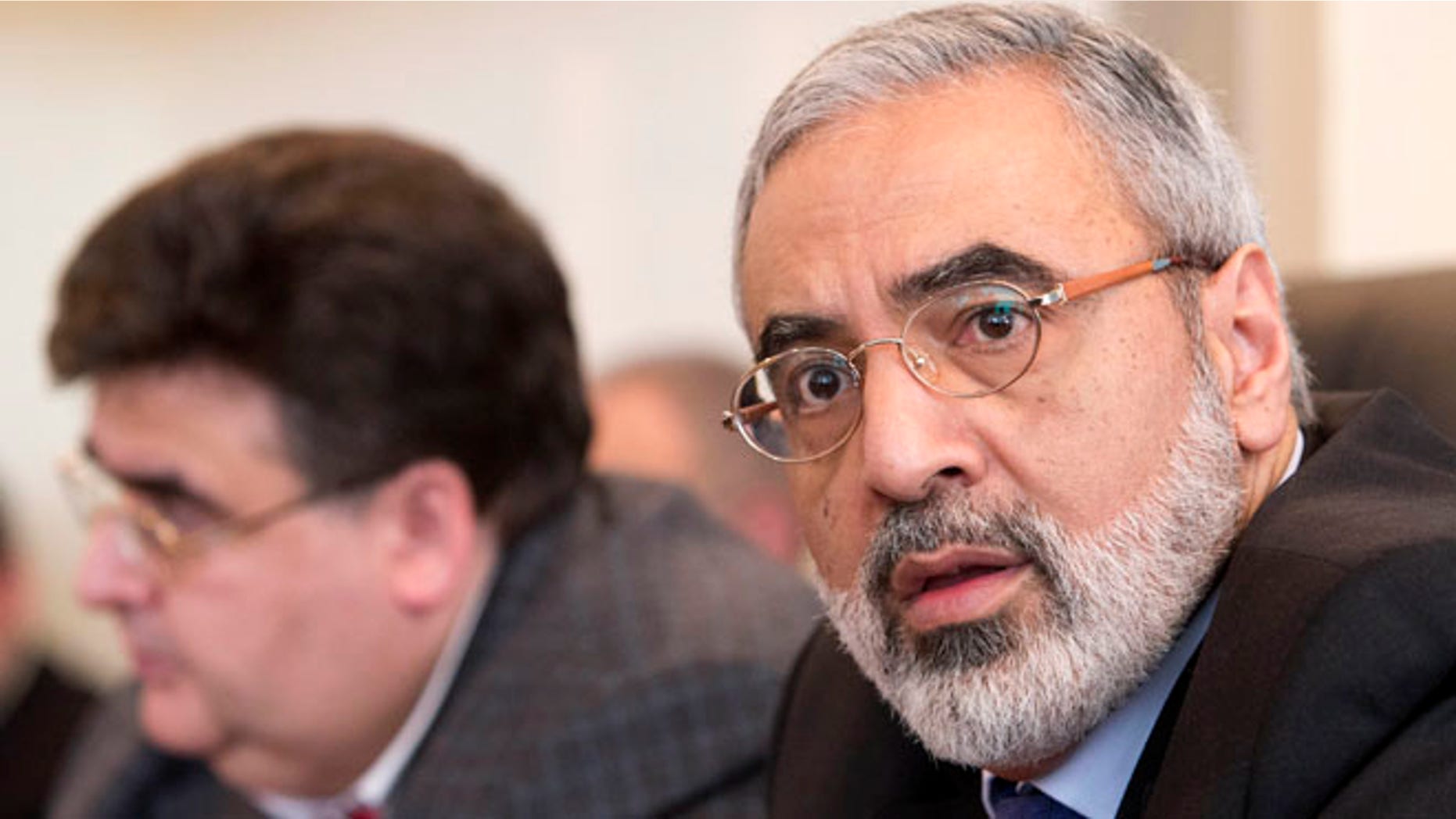 April 23, 2013: In this file photo, Syrian Information Minister Omran al-Zoubi, right, speaks during his visit to the Russian parliament's lower house in Moscow. The Syrian government wants more details before deciding whether to take part in a proposed U.S.-Russian initiative to negotiate a peaceful end to Syria's crisis, the country's information minister said Tuesday, May 14, 2013.