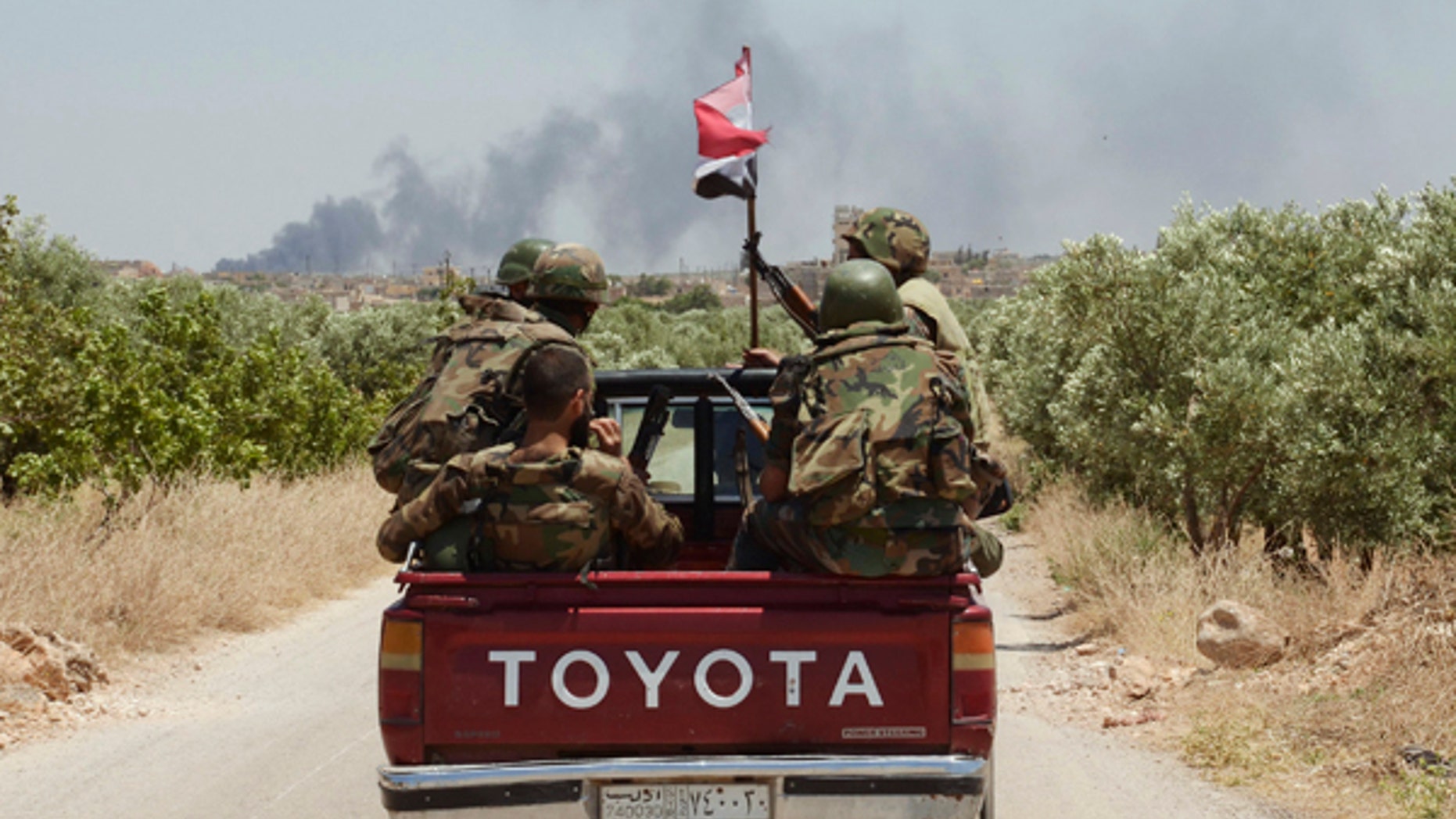 June 15, 2013: Forces loyal to Syria's President Bashar al-Assad are seen in Ain-Assan village during what they said was an operation to occupy it, in southern countryside of Aleppo.