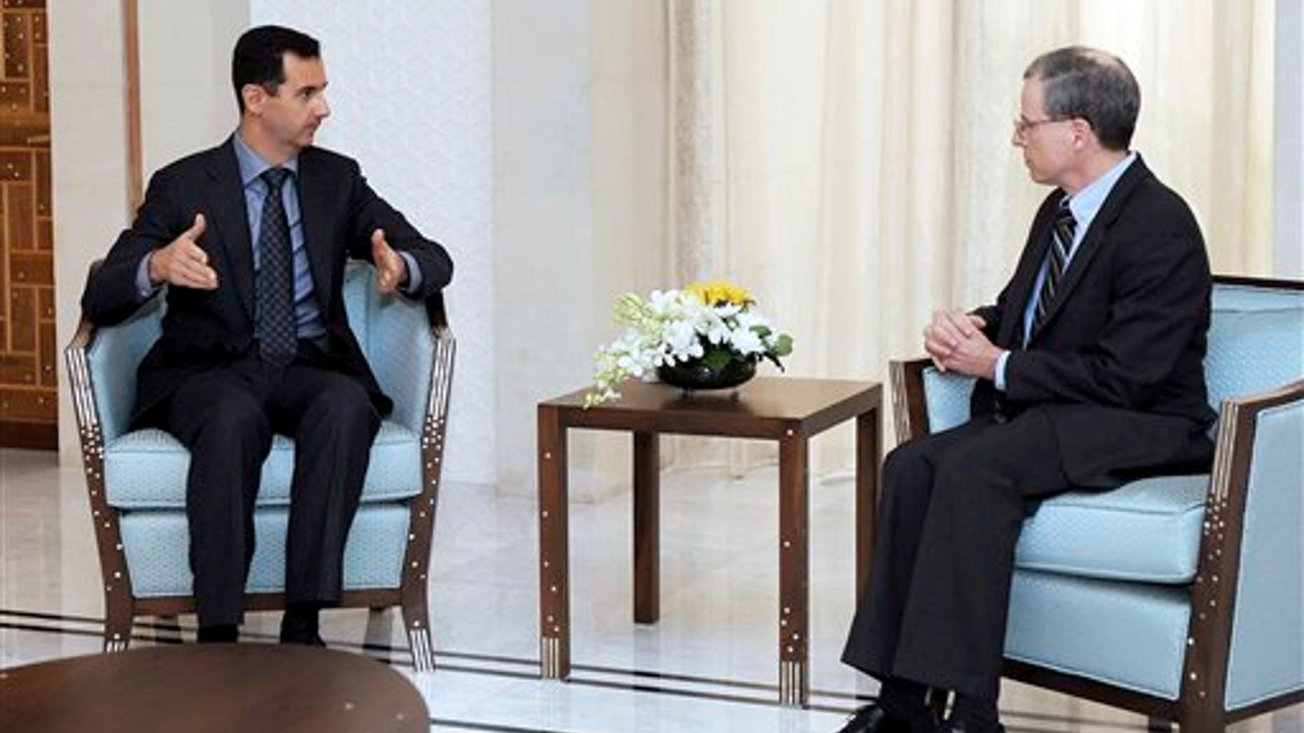 Jan. 27, 2011: Syrian President Bashar Assad, left, meets with Robert Ford, the U.S. ambassador to Syria, in Damascus, Syria.