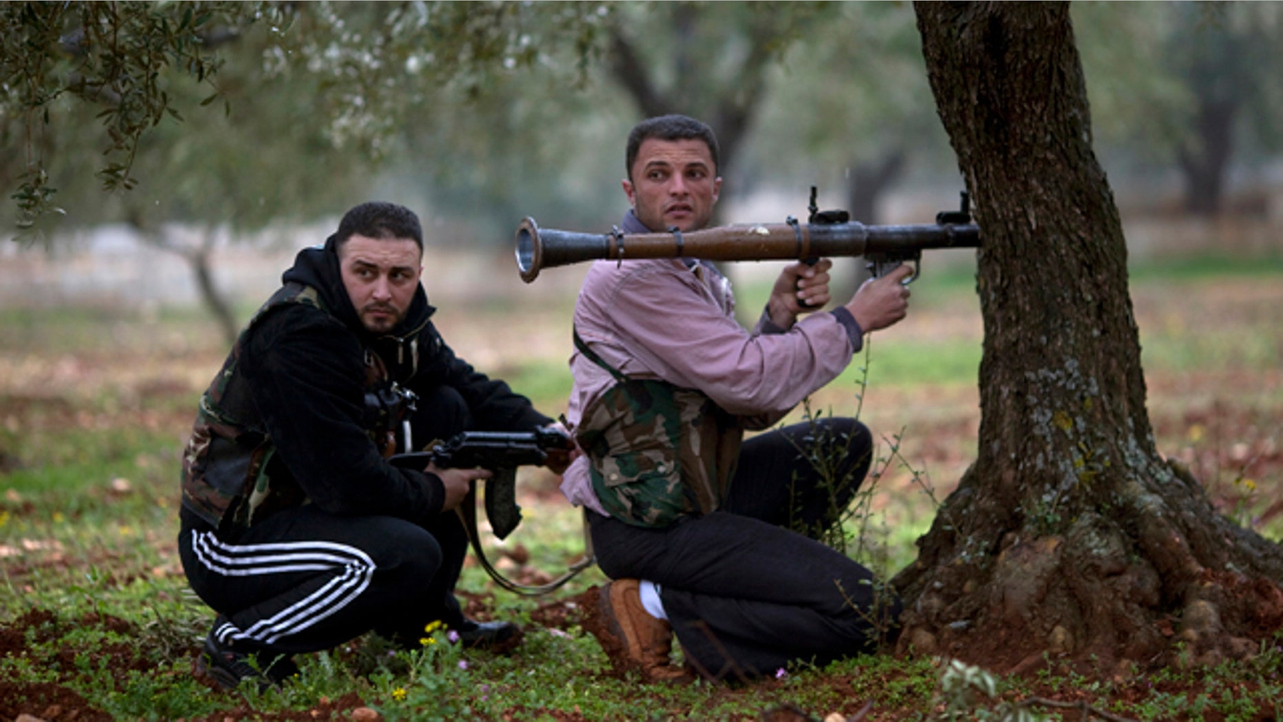 Feb. 27: Free Syrian Army fighters take positions as the Syrian Army advances towards the town of Sarmin, in northern Syria.