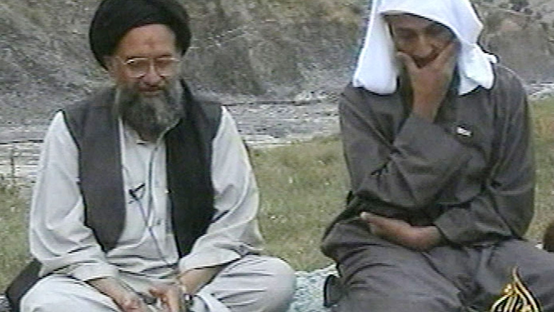 In this television image from Arab satellite station Al-Jazeera, Usama bin Laden, right, listens to his top deputy Ayman al-Zawahri speaking at an undisclosed location. The Associated Press says the CIA's pursuit of al-Zawahiri, a nine-year hunt at the root of last year's devastating suicide bombing at an agency base in Afghanistan, has come closer to capturing or killing the terrorist leader than previously known.