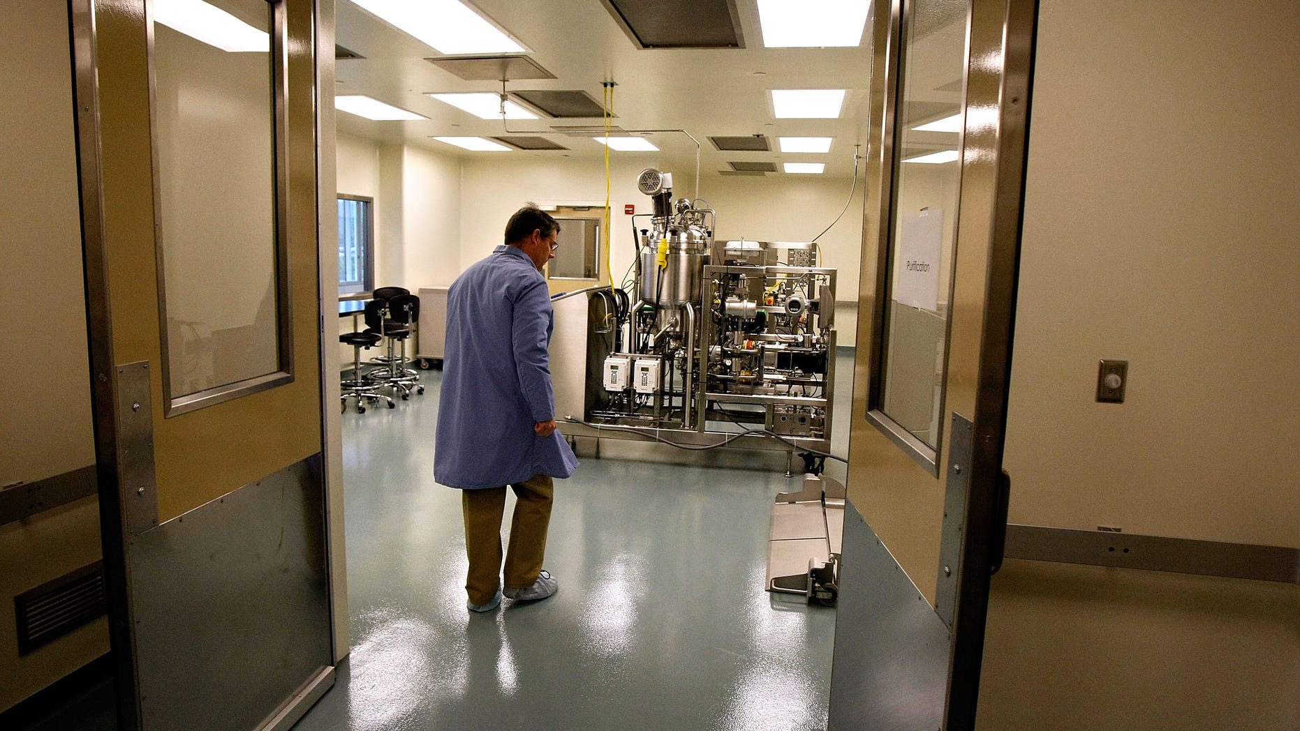 ROCKVILLE, MD - MAY 4: A guide leads visitors through the purification area of the Aeras Global TB Vaccine Foundations' new manufacturing plant May 4, 2009 in Rockville, Maryland. The multi-million dollar manufacturing facility will be capable of producing 200 million doses of a new TB vaccine. Aeras is a non-profit partnership that collaborates with various institutions to develop new TB vaccine candidates and delivery systems. Aeras is funded by the Bill and Melinda Gates Foundation, the Netherlands Ministry of Foreign Affairs, the Danish International Development Agency, and the Research Council of Norway, among others. (Photo by Chip Somodevilla/Getty Images)