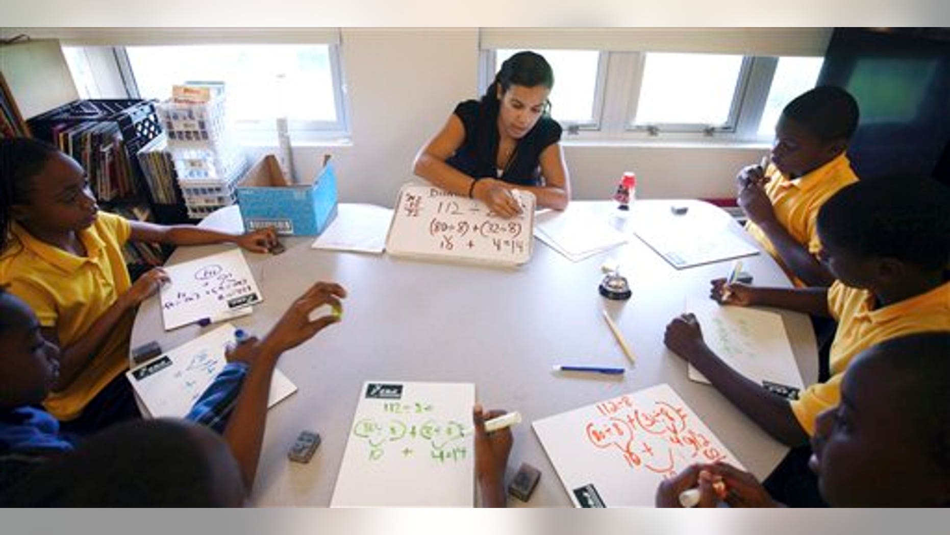 Sept. 1, 2011: Jennifer Mojica works with students in her math class at Holmes Elementary School in Miami.