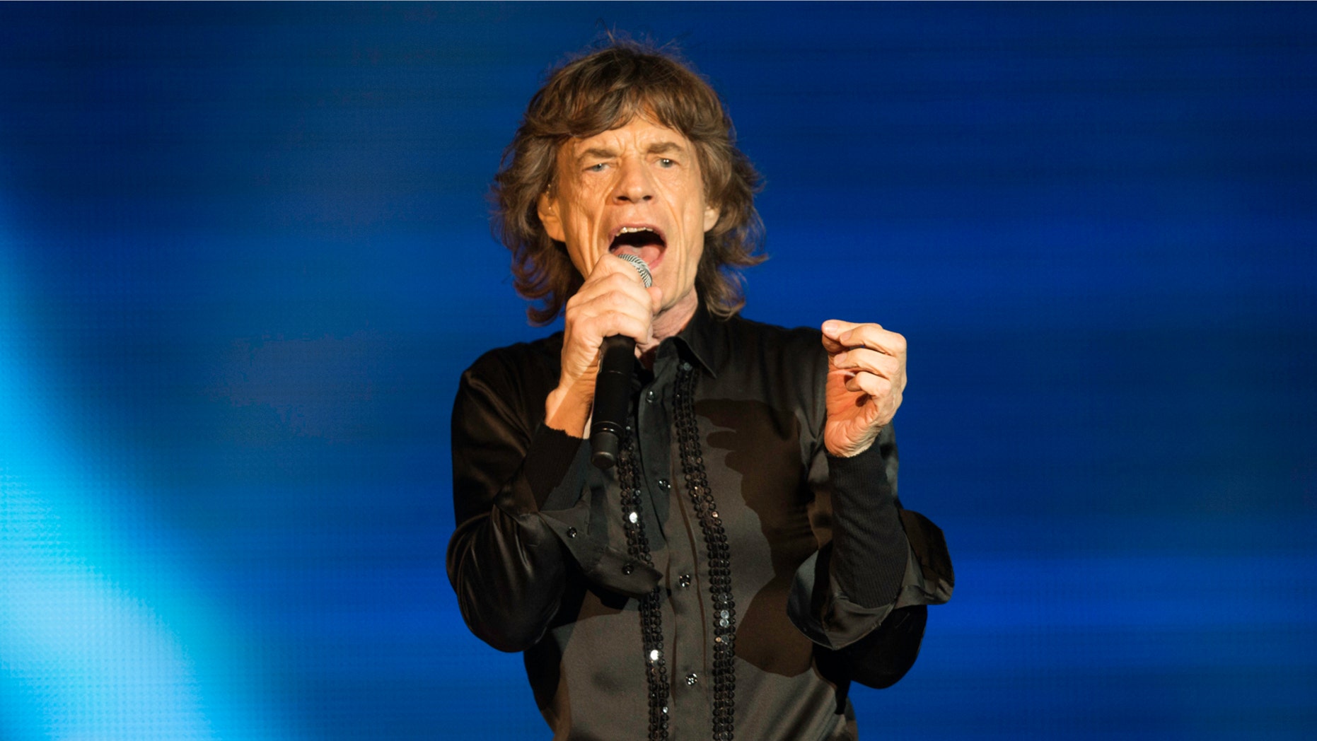 ABU DHABI, UNITED ARAB EMIRATES - FEBRUARY 21: Mick Jagger of The Rolling Stones performs at du Arena, Yas Island on February 21, 2014 in Abu Dhabi, United Arab Emirates. (Photo by Neville Hopwood/Getty Images)