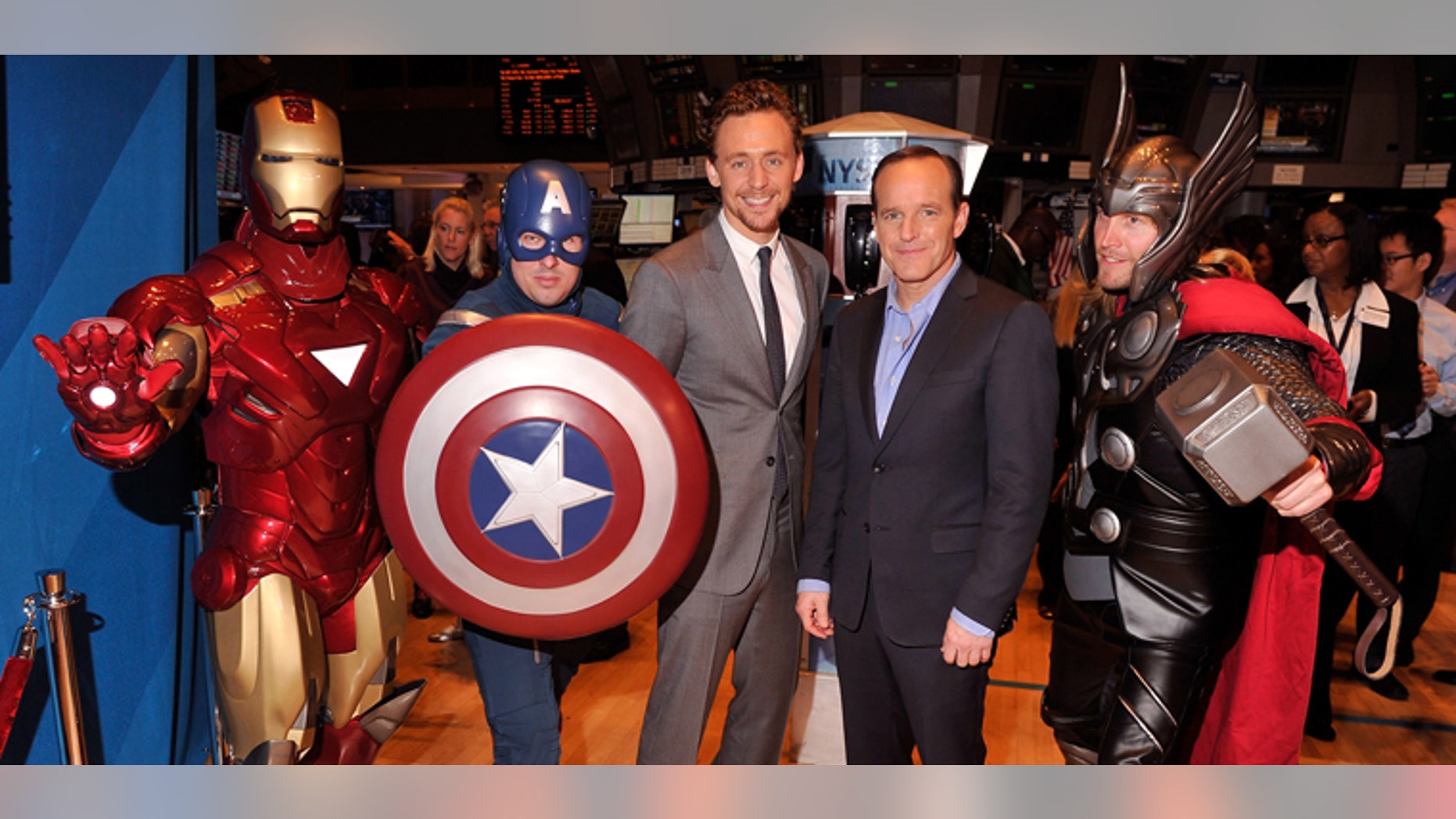 May 1, 2012: Actors Tom Hiddleston (third from left) and Clark Gregg (second from right) pose for a photo aa celebration of the release of Marvel Studios "The Avengers" after ringing the opening bell at the New York Stock Exchange in New York City.