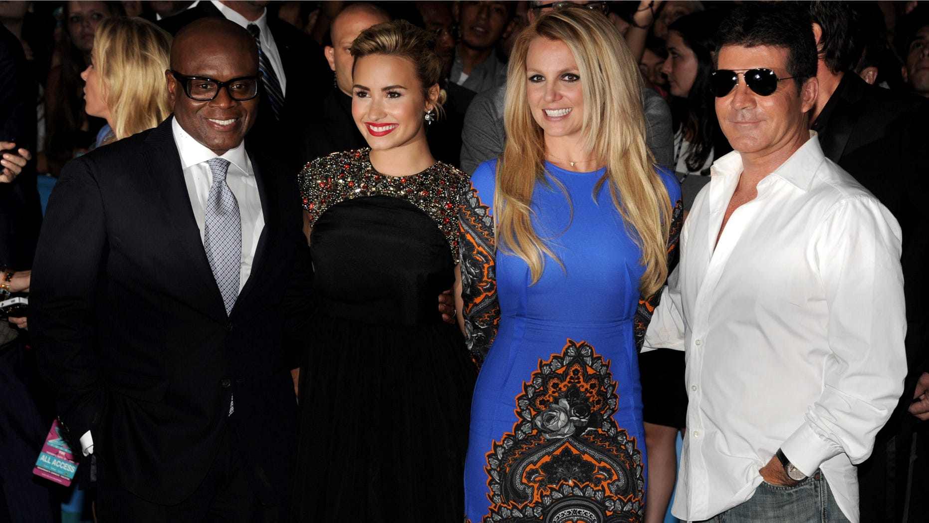 LOS ANGELES, CA - SEPTEMBER 11: The X Factor judges (L-R) L.A. Reid, Demi Lovato, Britney Spears and Simon Cowell pose at the premiere of Fox's "The X Factor" Season 2 and handprint ceremony at the Chinese Theatre on September 11, 2012 in Los Angeles, California. (Photo by Kevin Winter/Getty Images)