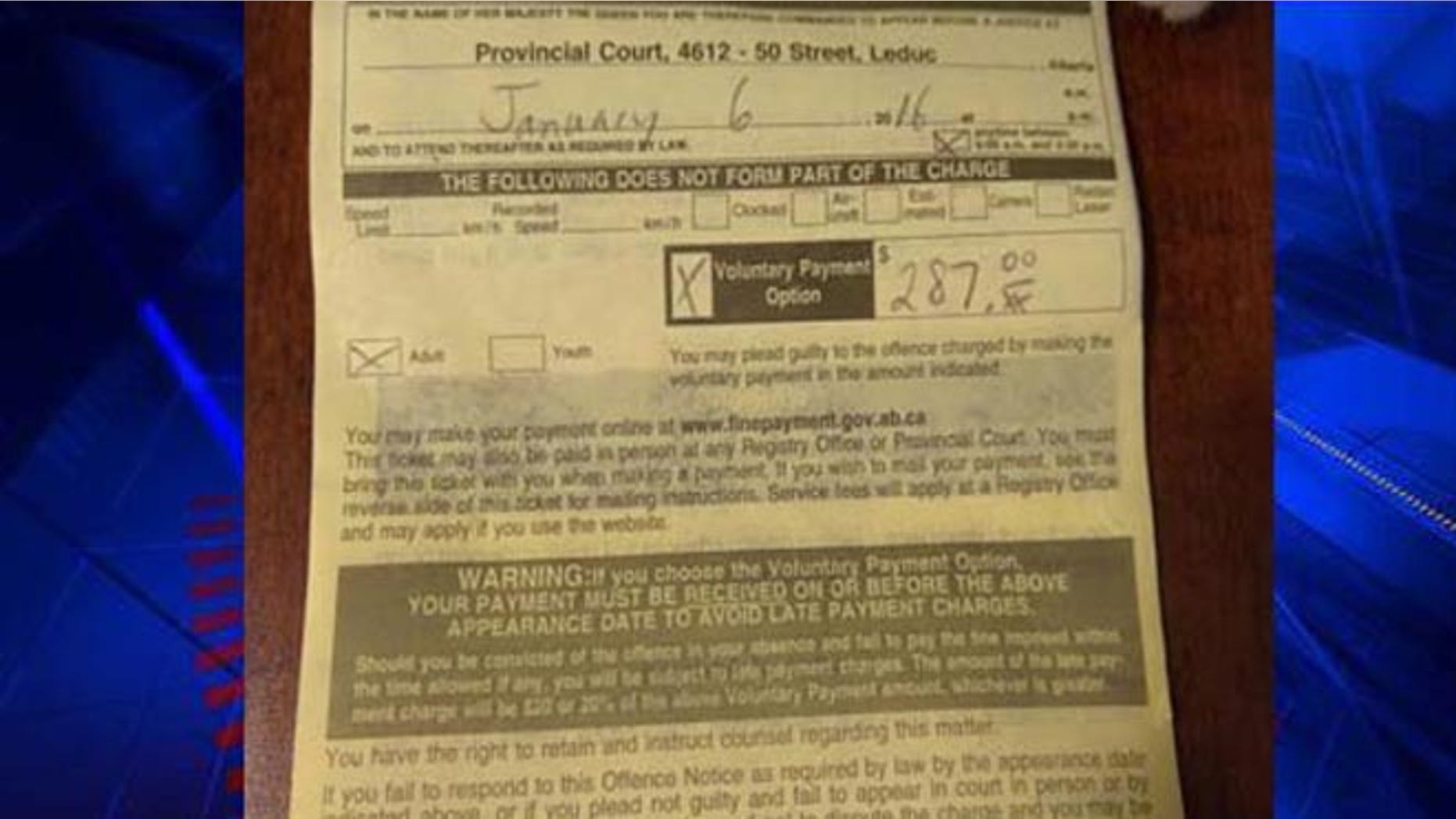 A. J. Daoust's $287 summons for texting in a drive-thru in Canada.
