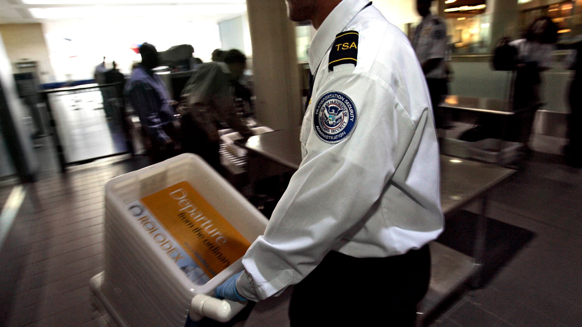 FILE - This Jan. 10, 2007 file photo shows Transportation Security Officer Juan Morales at the Los Angeles International Airport in Los Angeles.