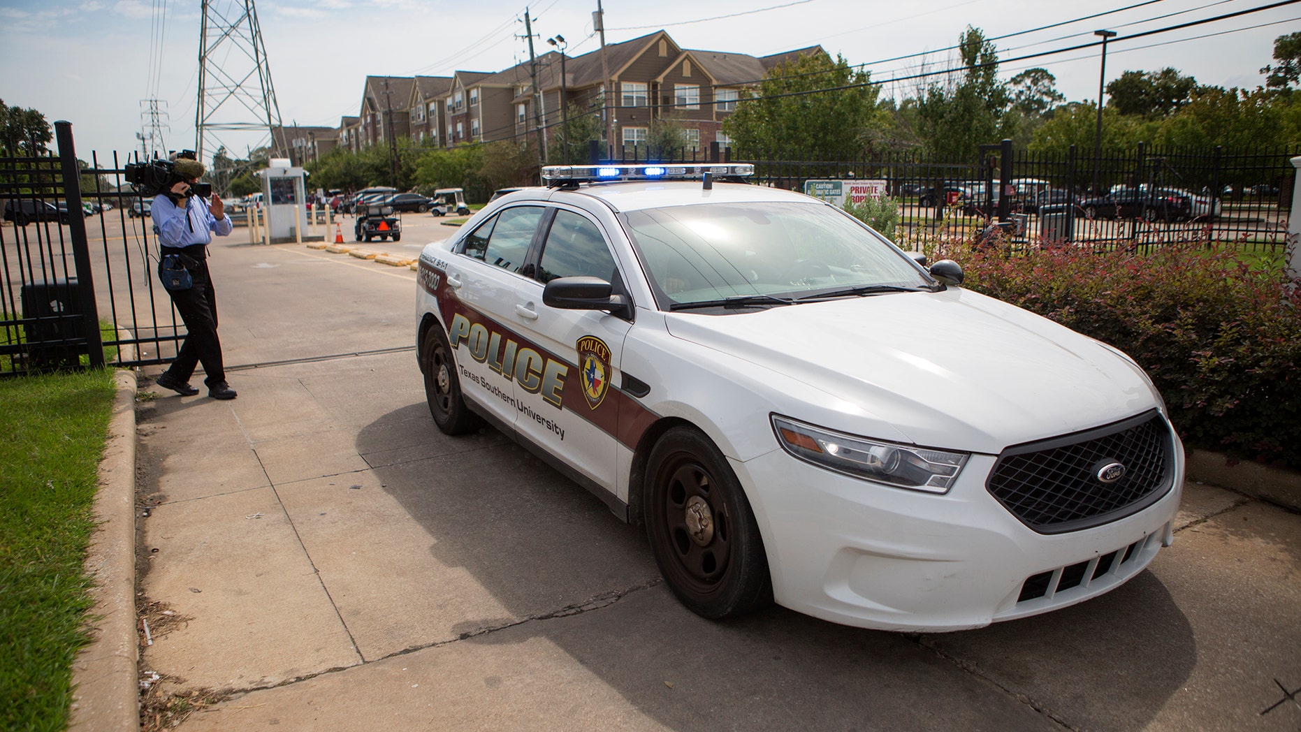 Authorities investigate a shooting at Texas Southern University, Friday, Oct. 9, 2015, in Houston. A student was killed and another person was wounded in a shooting outside a student-housing complex on Friday. (Cody Duty/Houston Chronicle via AP)