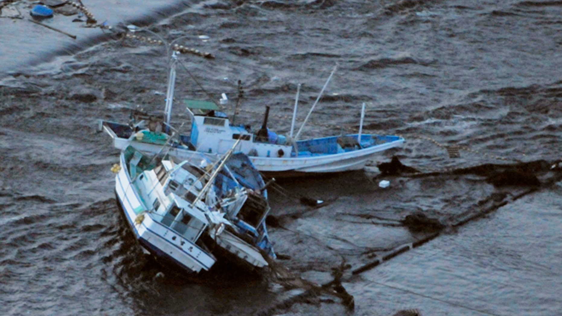 March 11: Fishing boats get stranded on shore at Oarai town, Ibaraki prefecture (state), Japan, after a ferocious tsunami spawned by one of the largest earthquakes ever recorded slammed Japan's eastern coasts.