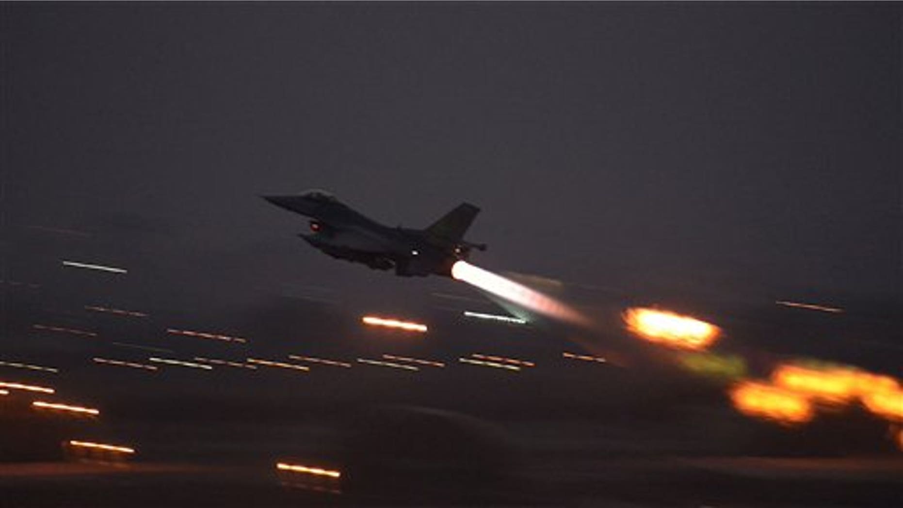 In this image provided by the U.S. Air Force, an F-16 Fighting Falcon takes off from Incirlik Air Base, Turkey, as the U.S. on Wednesday, Aug. 12, 2015, launched its first airstrikes by Turkey-based F-16 fighter jets against Islamic State targets in Syria. (Krystal Ardrey/U.S. Air Force via AP))
