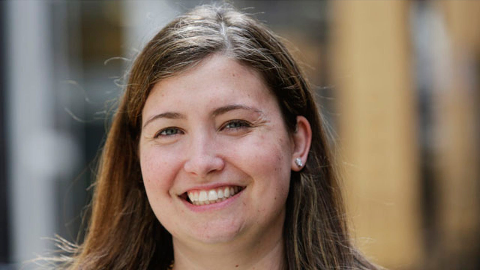 FILE - This Wednesday, May 28, 2014 photo shows Julia Collins, 31, of Wilmette, Ill., after an interview with The Associated Press in Chicago. (AP Photo/Teresa Crawford, file)