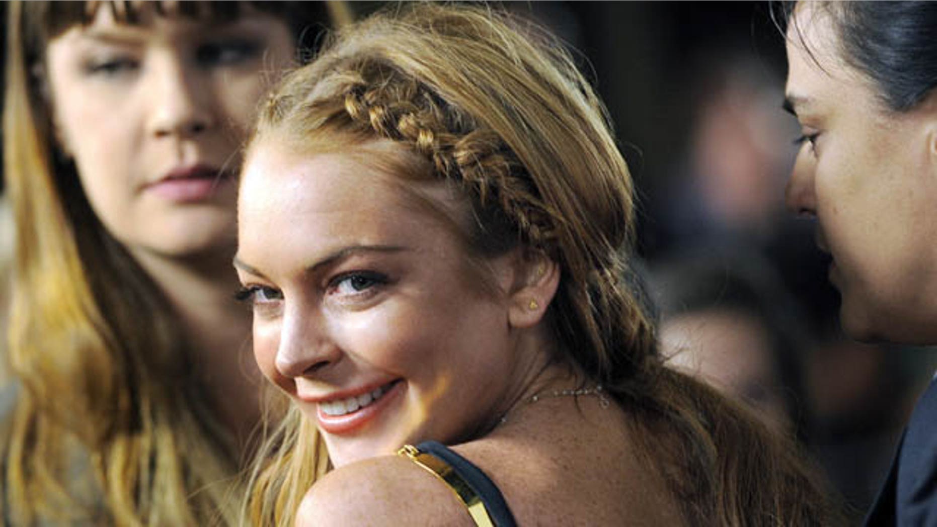 FILE - This April 11, 2013 file photo shows actress Lindsay Lohan, a cast member in "Scary Movie V," at the premiere of the film in Los Angeles. (Photo by Chris Pizzello/Invision/AP, File)