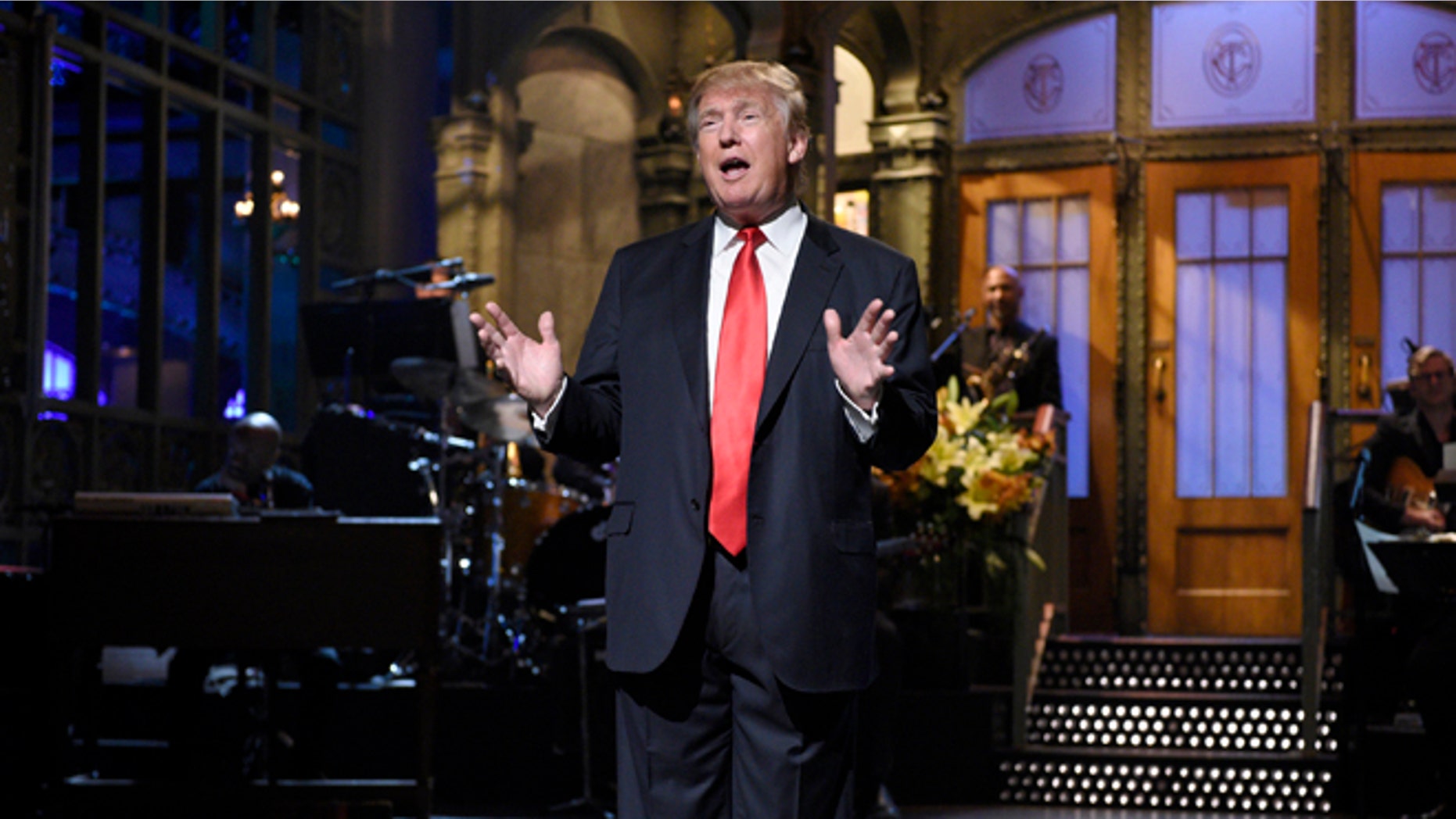 Republican presidential candidate Donald Trump speaks as guest host during the monologue on "Saturday Night Live", Saturday, Nov. 7, 2015. Trump's 90 minutes in the "SNL" spotlight followed weeks of growing anticipation, increasingly sharp criticism and mounting calls for him to be dropped from the show. (Dana Edelson/NBC via AP)
