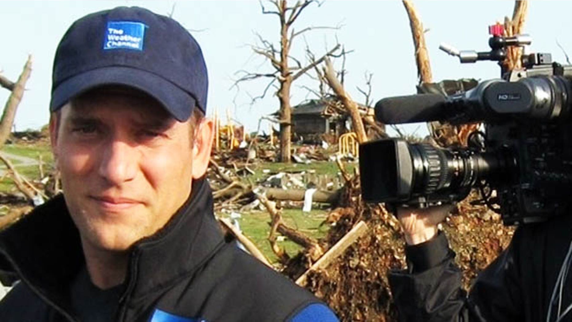 This 2011 image released by the Weather Channel shows meteorologist Mike Bettes at the scene of a tornado in Joplin, Mo. Bettes will hit the road starting Monday for "Tornado Week," his network's version of "Shark Week" thats usually its biggest scheduled programming event of the year. "Tornado Week" will include a special about chasers caught up in the tornado in El Reno, Okla. A new series, "Tornado Alley," will premiere with storm footage, survivor tales and computer graphics to simulate actions of certain tornadoes. (AP Photo/Weather Channel)