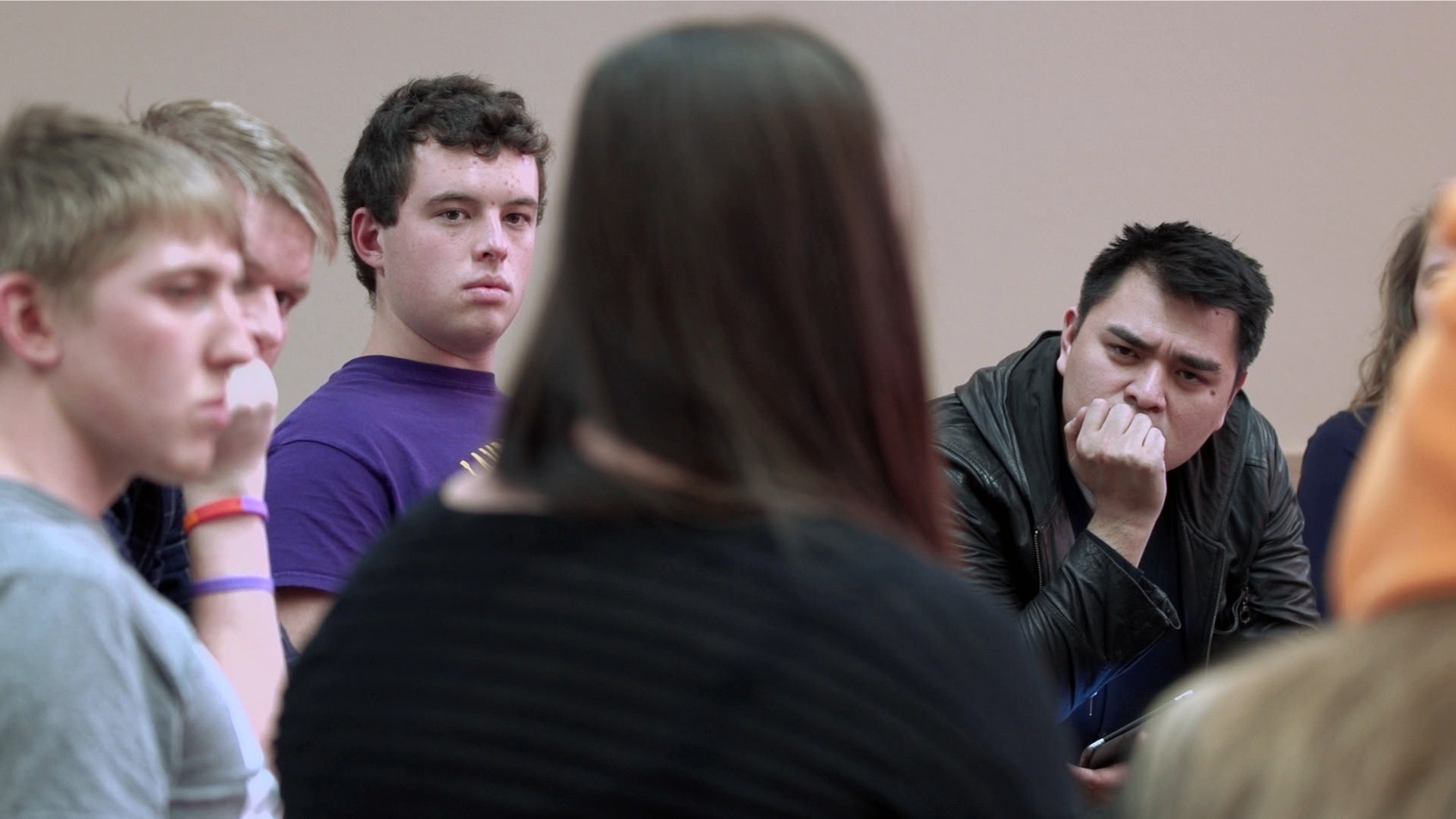 filmmaker Jose Antonio Vargas listens to a group of young people during the filming of his documentary "White People."