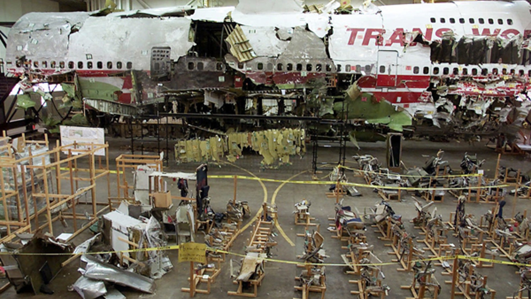 This July 16, 2001 file photo shows the seats, foreground, and the wreckage of TWA Flight 800 in a hangar in Calverton, N.Y.