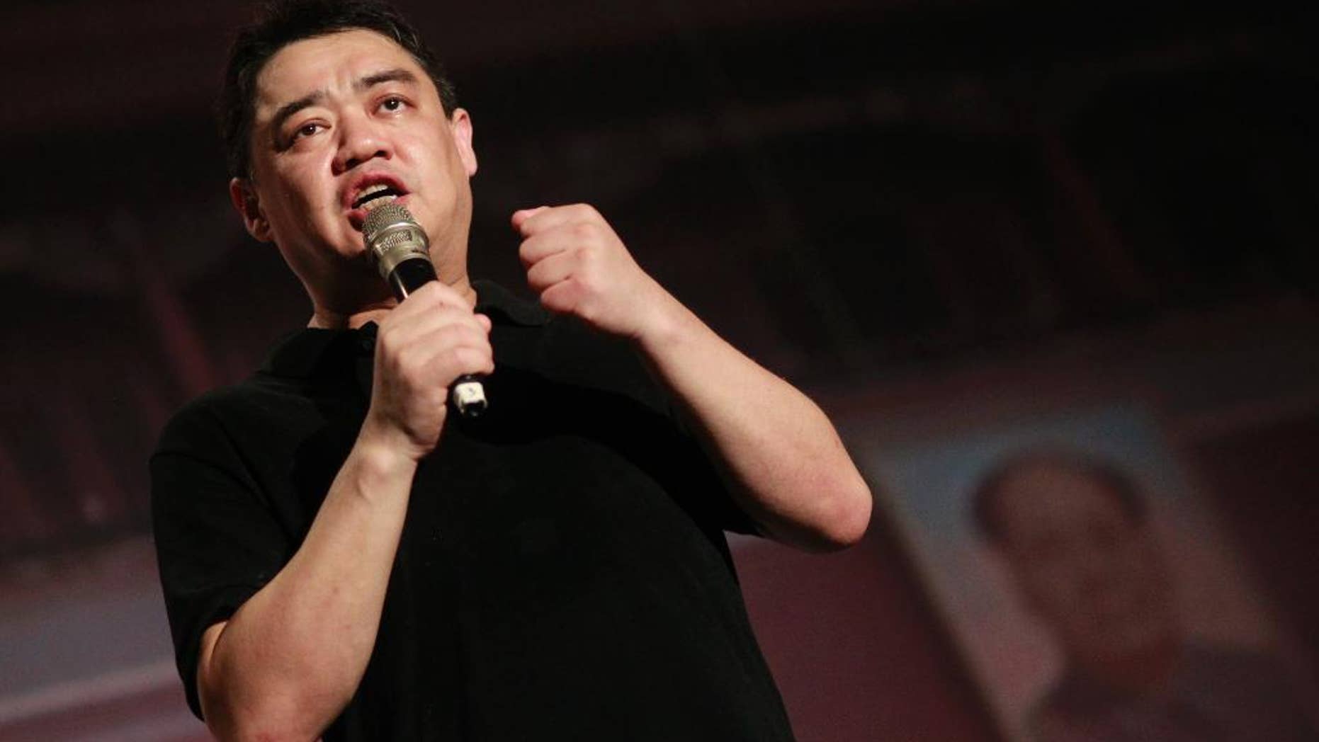 FILE - In this June 4, 2014, photo, former student leader in the protests of 1989, Wu'er Kaixi, speaks in front of a mock Tiananmen Square backdrop during a vigil in Taipei, Taiwan, to mark the 25th anniversary of the June 4th Chinese military crackdown on the pro-democracy movement in Beijing. Prominent exiled Chinese dissident Wu'er Kaixi announced his candidacy Friday, July 24, 2015, for a seat in Taiwan's parliament, saying he wants to serve as a check on the ruling Nationalist Party and help shore up the island's global status. (AP Photo/Wally Santana, File)